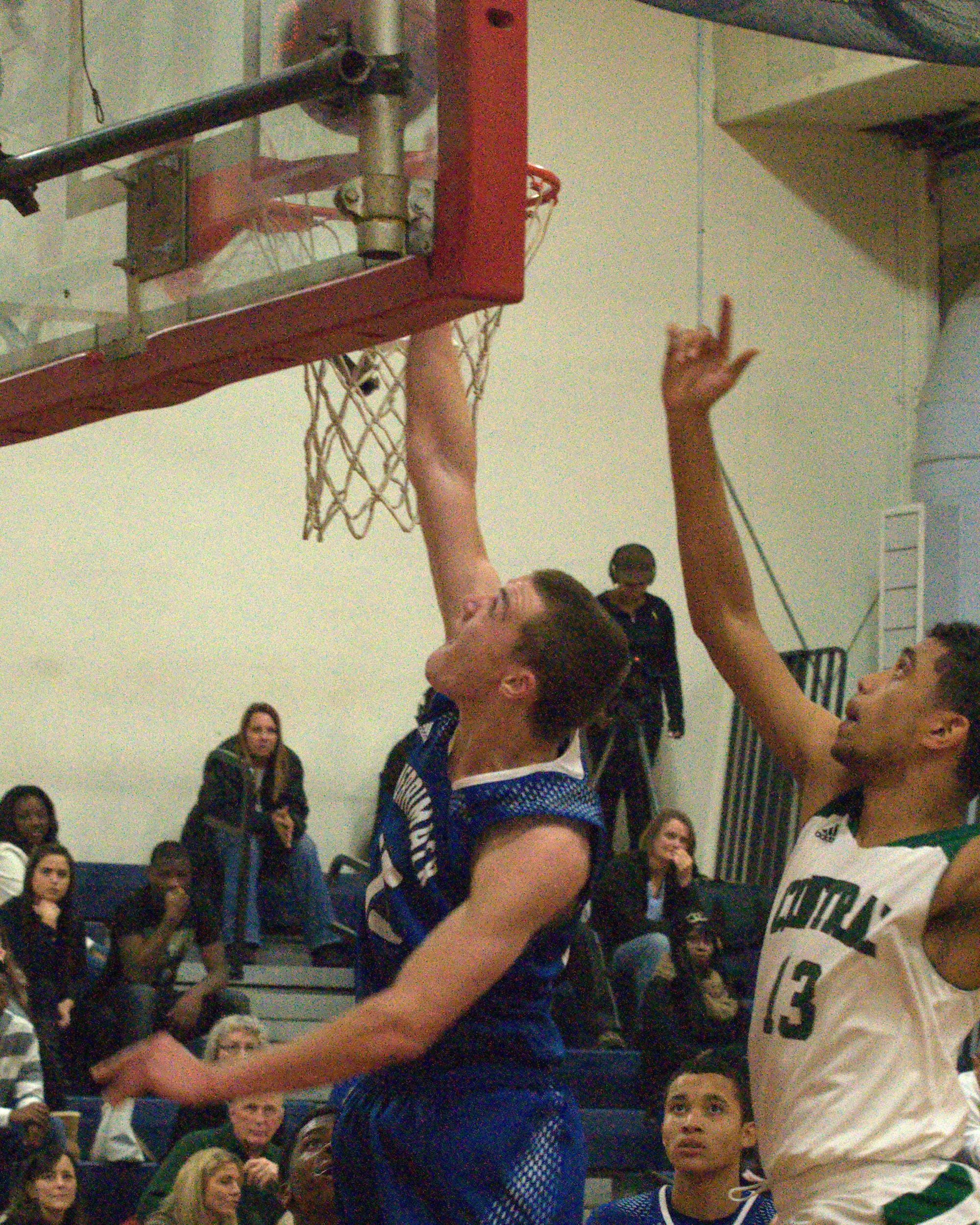 Merrimack's Dylan Richardson goes to the basket against Manchester Central's Jaylen Leroy.