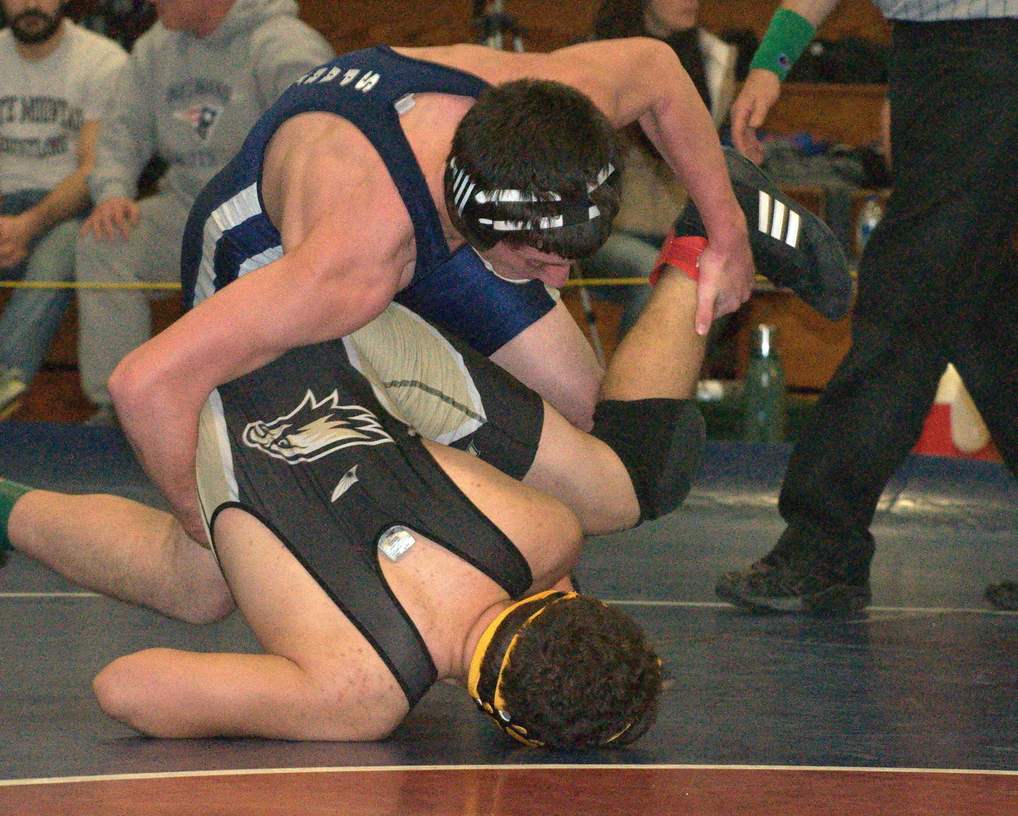 Milford's Jake Ricca wrestles Dean Tech's Jalen Cruz in a 170-pound semifinal match at Saturday's Milford/Souhegan Tournament. For more photos, go to the Photo Album.
