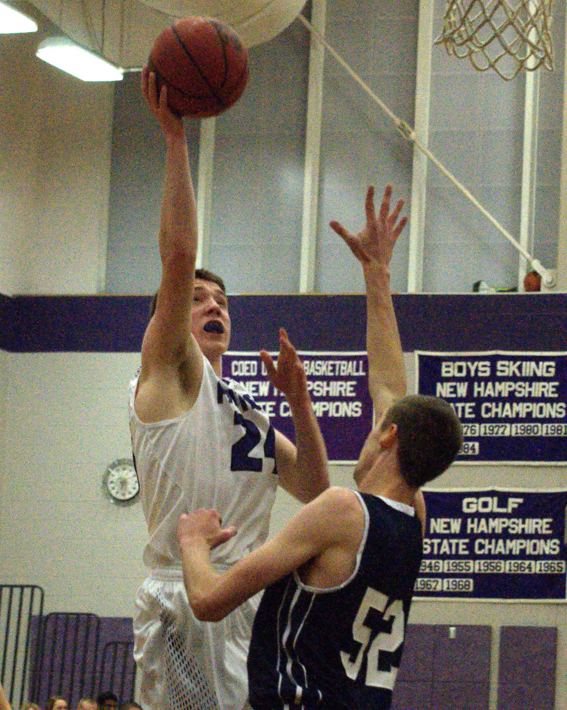 Nashua South's Ryan Penkala puts up a shot over Milford's A.J. Smith during Monday's game.