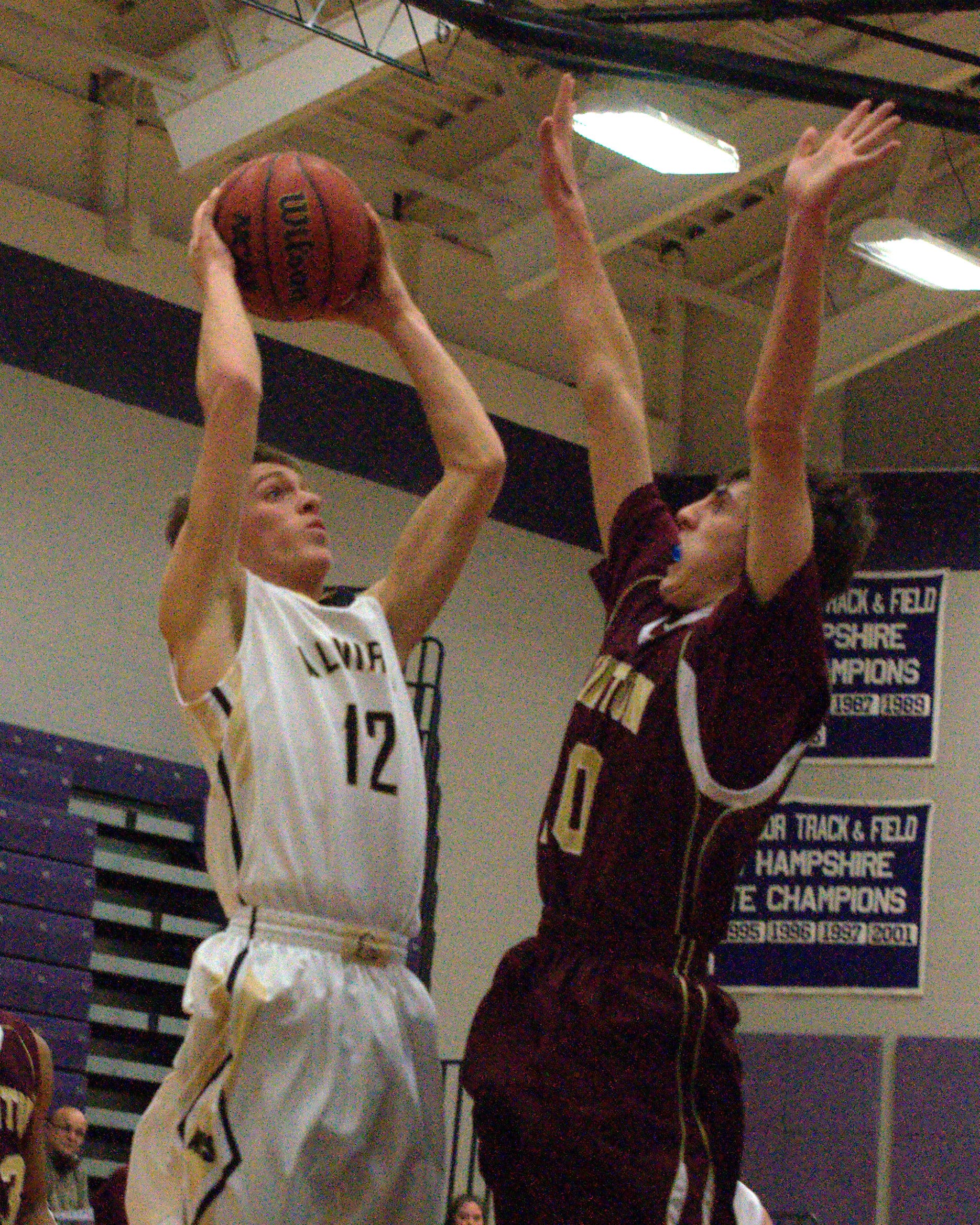 Thornton's Ben Lambert tries to block a shot by Alvirne's Connor Hodsdon.