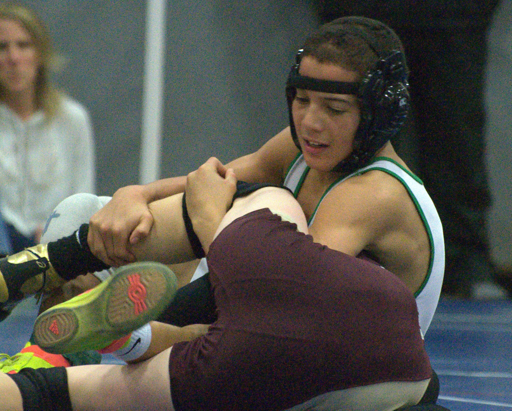 Bishop Guertin's Jordan Rowlette wrestlers Alvirne's Cam McClure during Saturday's tournament.