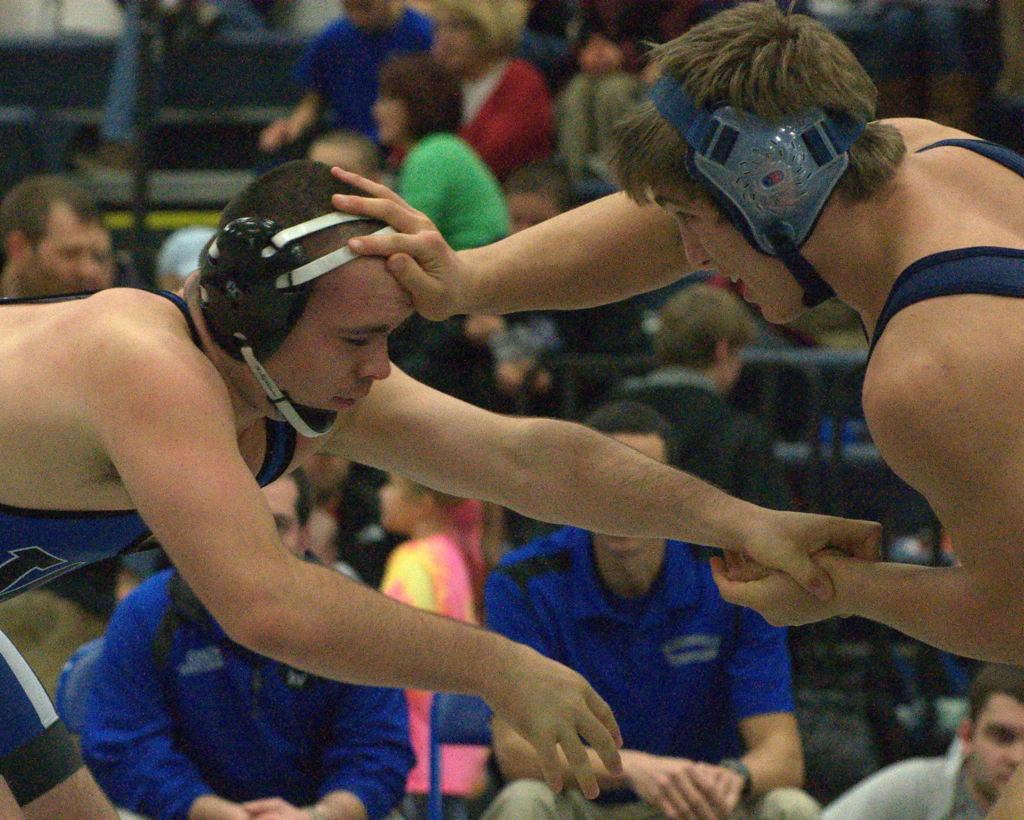 Winnisquam's Richie Mills wrestles Hollis Brookline's Caleb Lomme in the semifinals.
