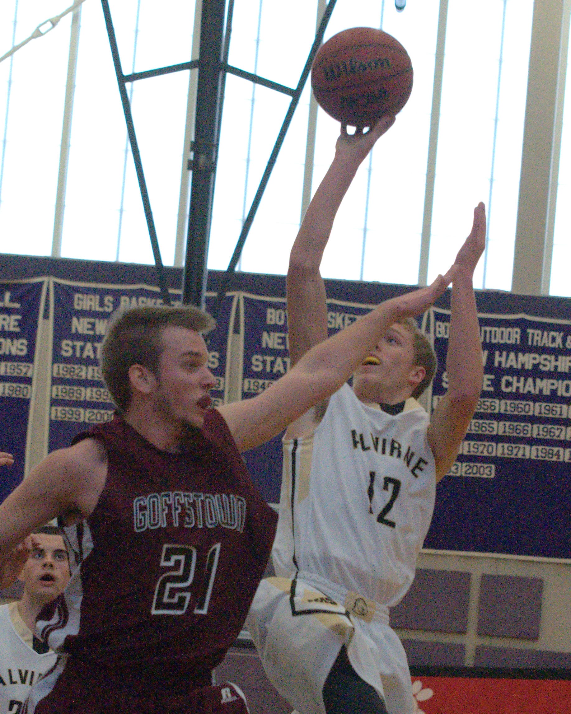 Alvirne's Connor Hodsdon takes a shot over Goffstown's Mike Bailey.