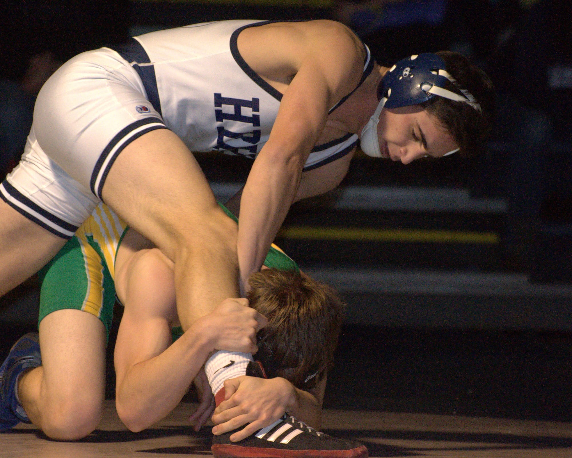 Hollis Brookline's Nick McPherson tries to remove Bishop Guertin's Matt Hauntsman during Wednesday's match.