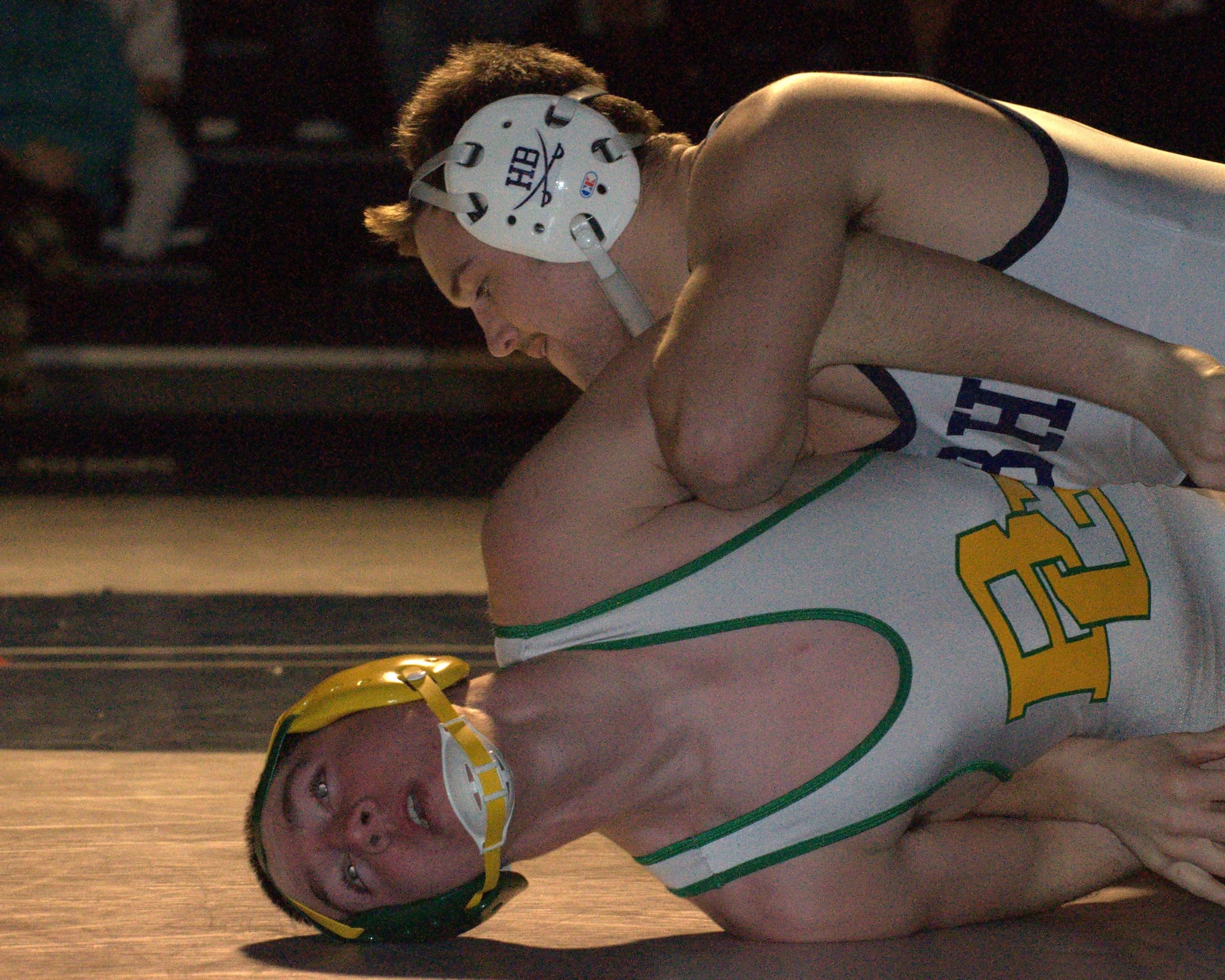 Hollis Brookline's Wyatt Farwell wrestles Bishop Guertin's Mitchell Lachs.
