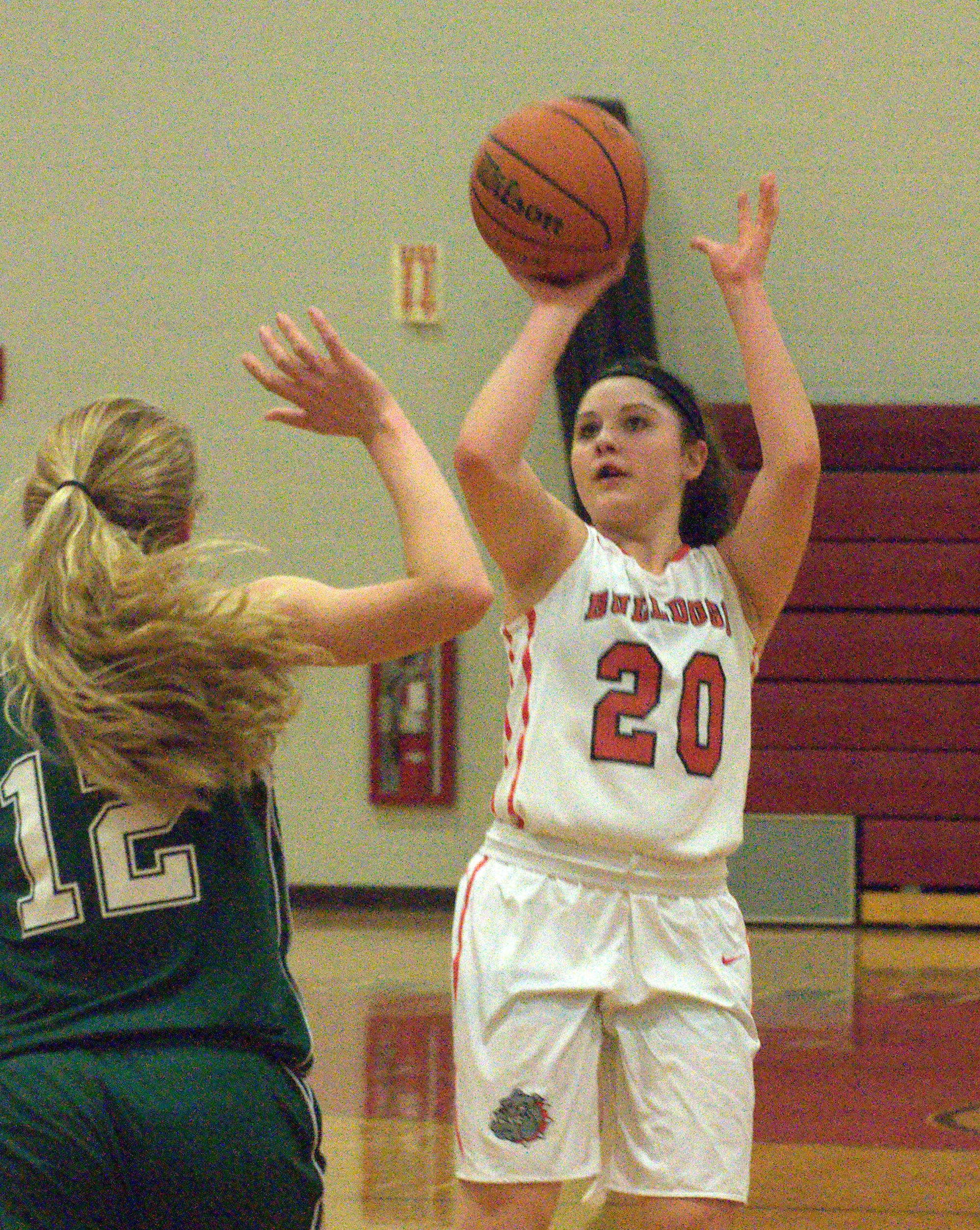 Bedford's Nikki Tucci takes a shot before Dover's Abigail Cooke can challenge it.