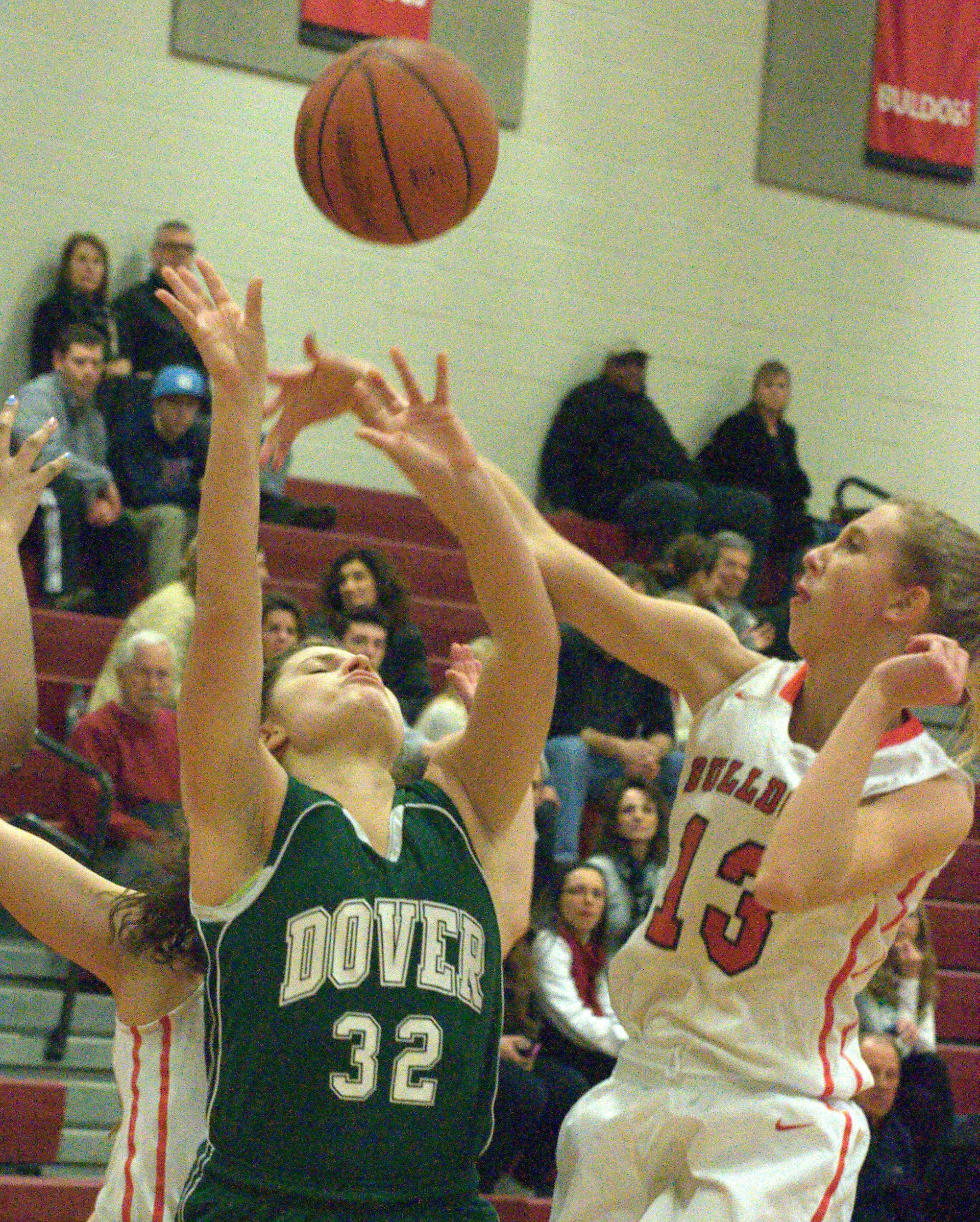Bedford's Courtney O'Connell blocks a shot by Dover's Mercedes McDermott during Wednesday's game. For more photos, go to the Photo Album.