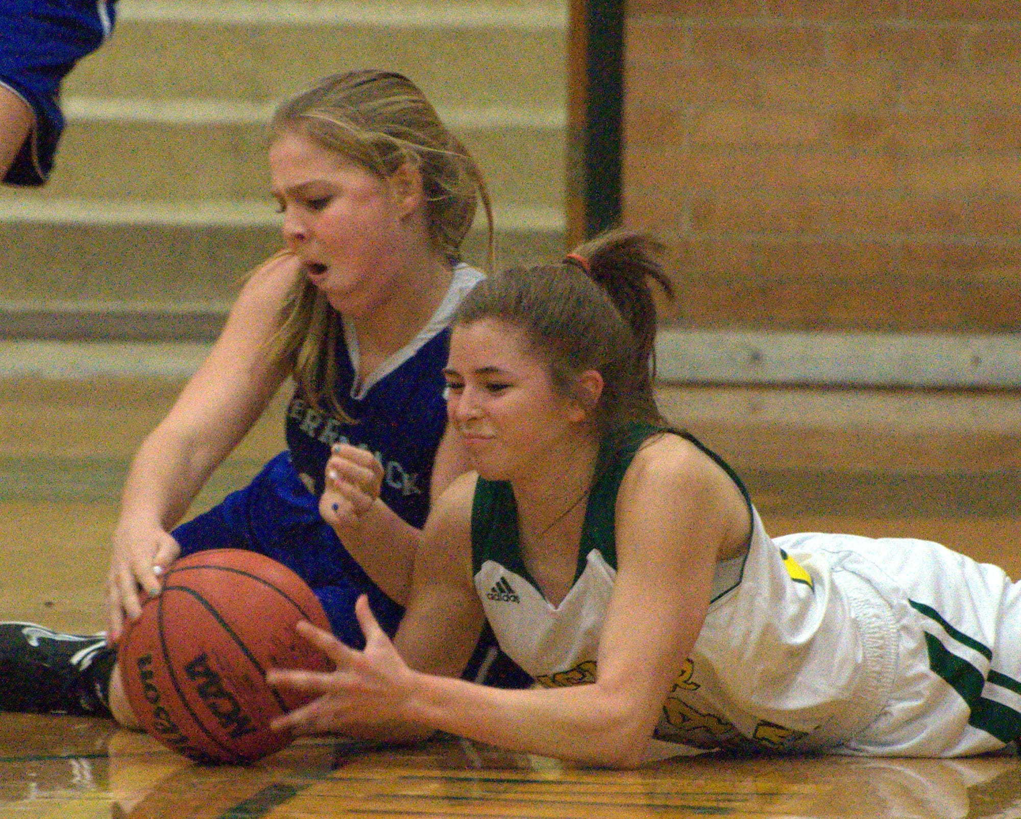 Merrimack's Amanda D'Amico and Bishop Guertin's Alissa Zajac fight for a loose ball during Thursday's game.