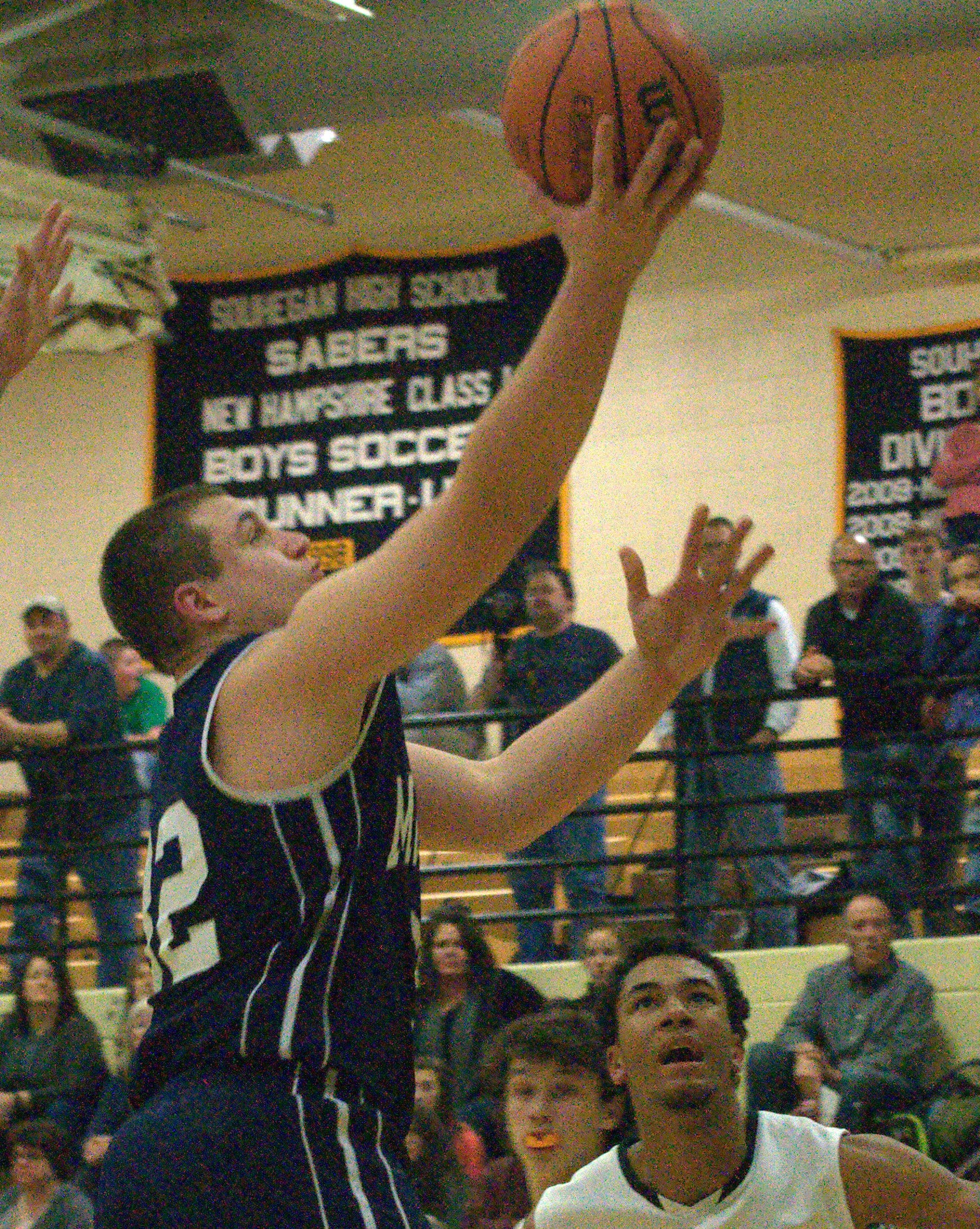 Milford's Kirk Palladino goes in for a layup.