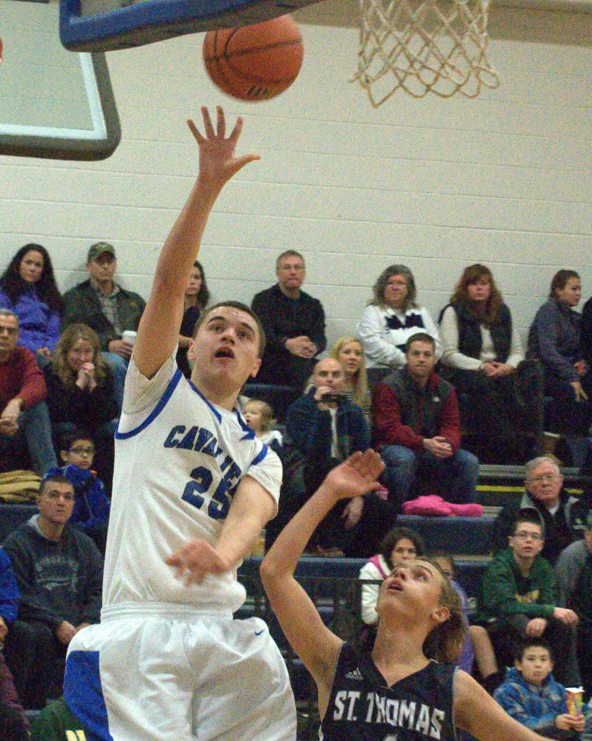 Hollis Brookline's Will Petersen takes a shot during Saturday's game against St. Thomas.