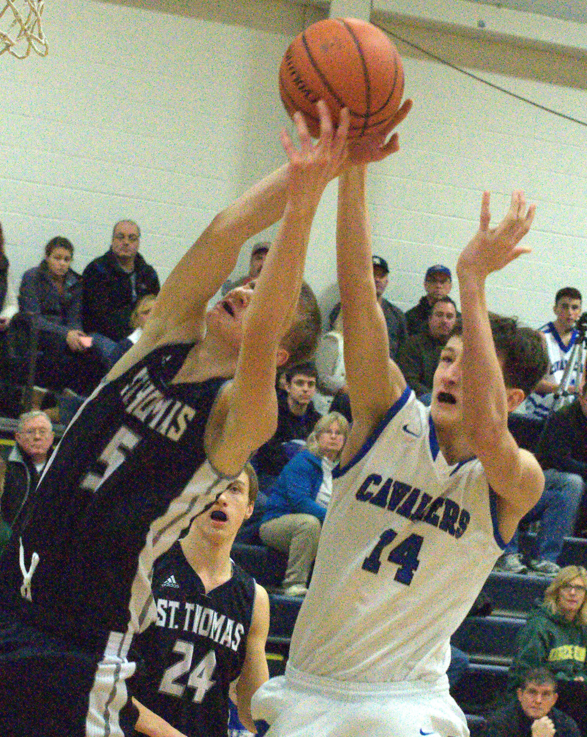 St. Thomas' Joseph Grinde and Hollis Brookline's Kyle Szewczky battle for a rebound.
