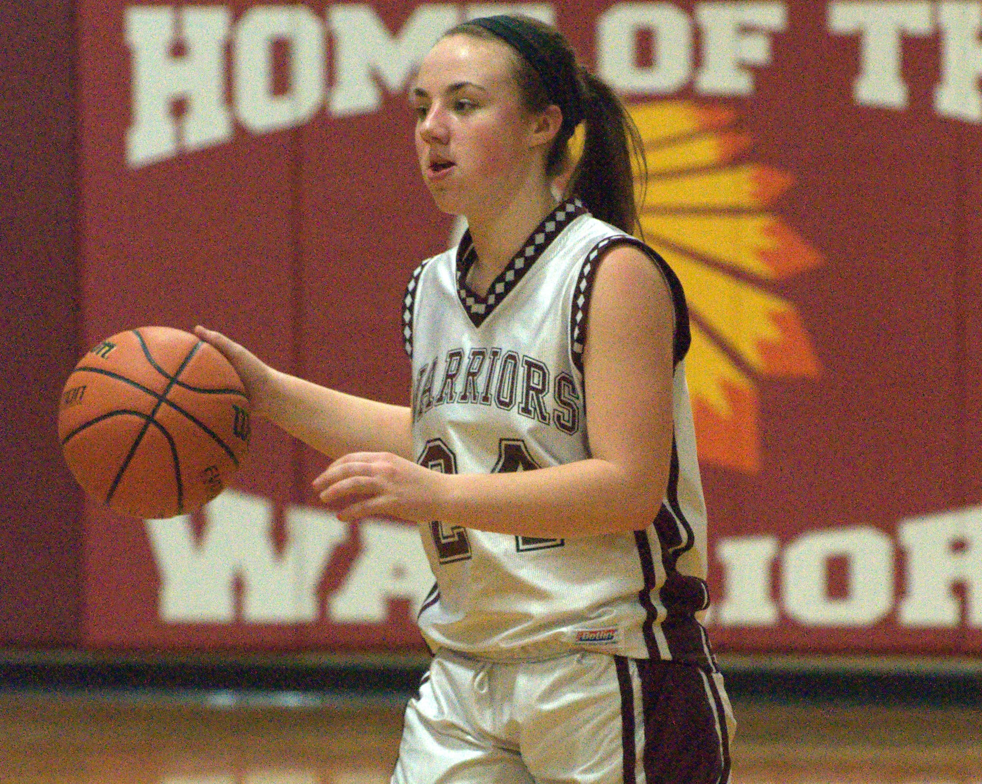 Wilton-Lyndeborough's Ally Schwab brings the ball down the court during Tuesday's game against Newmarket.