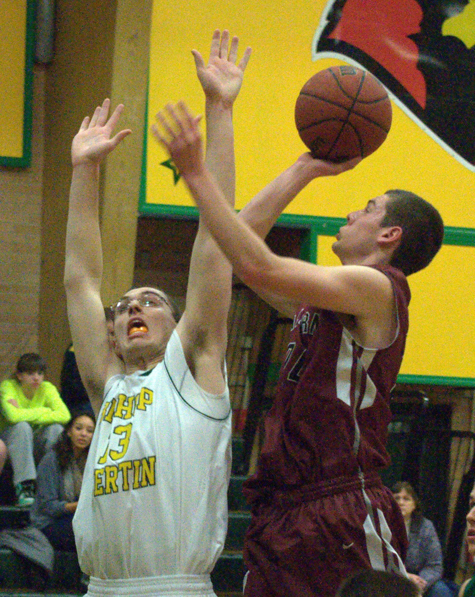 Alvirne's Andrew Wetmore puts up a shot as Bishop Guertin's Chad Olivieri defends.