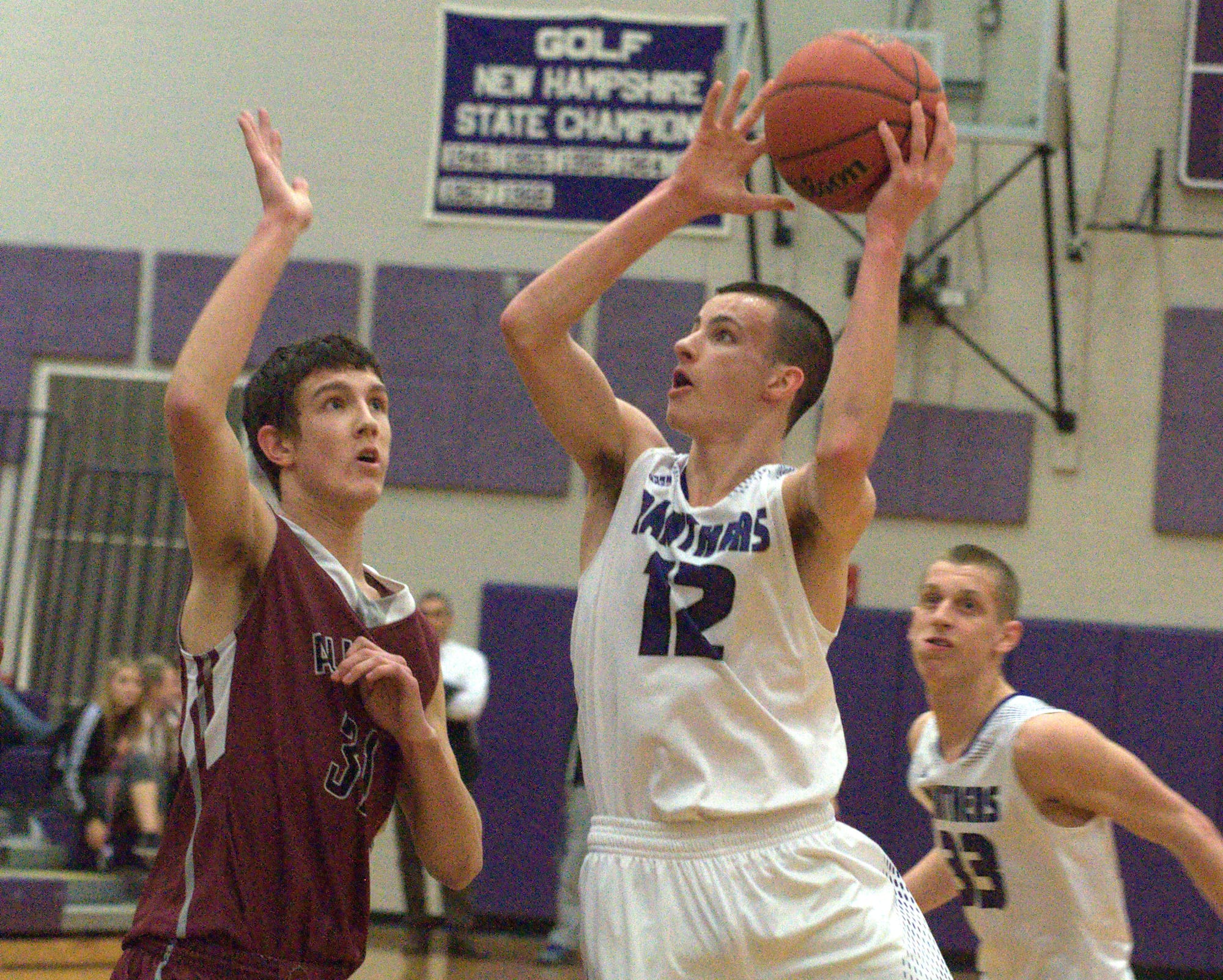 Nashua South's DJ Frechette goes to the basket during Tuesday's game as Alvirne's Sam Bonney-Liles defends.