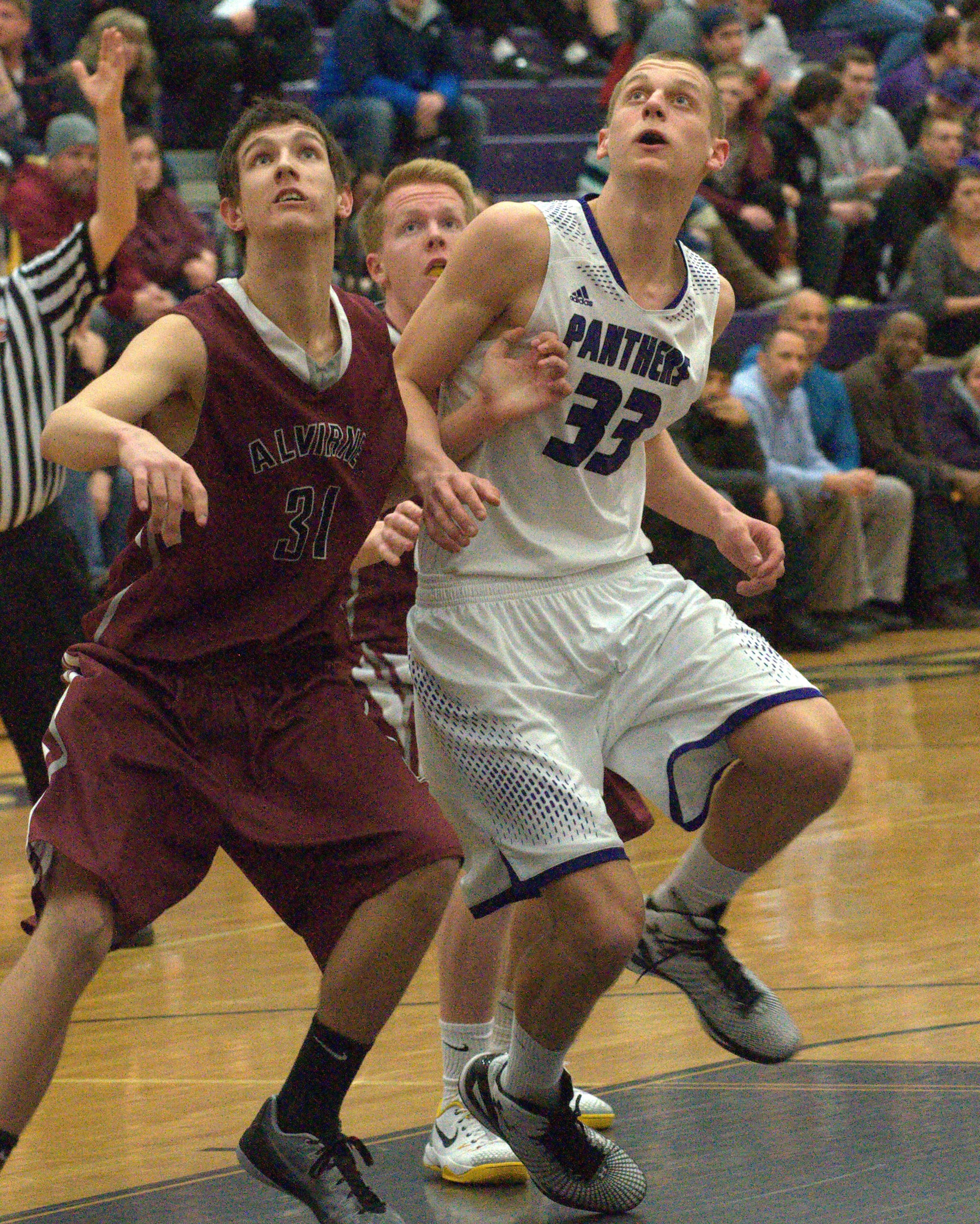 Alvirne's Sam Bonney-Liles and Nashua South's Mike Osgood battle for position.