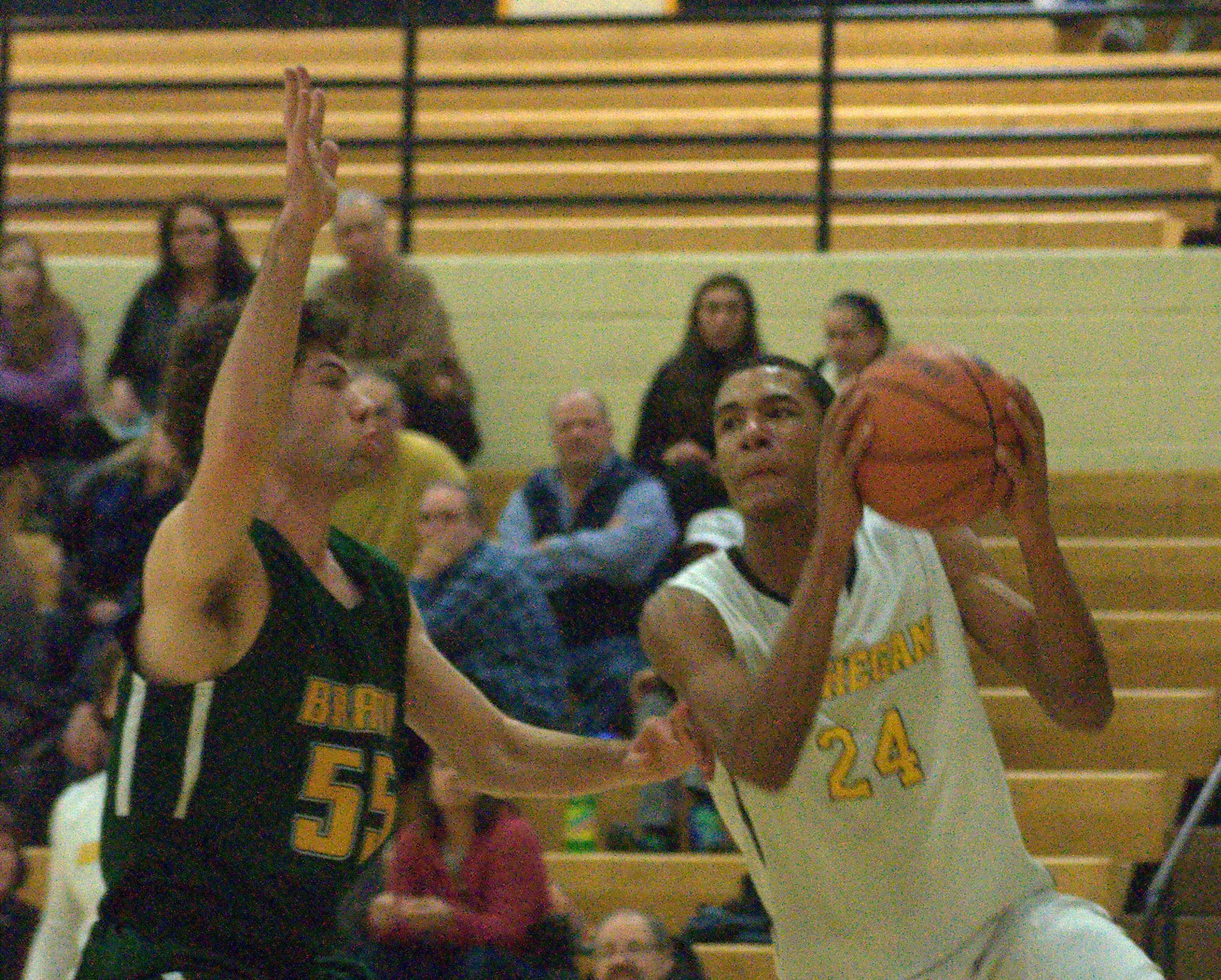 Bishop Brady's Aaron Svendson tries to keep Souhegan's Jerrell Webster from getting to the basket.