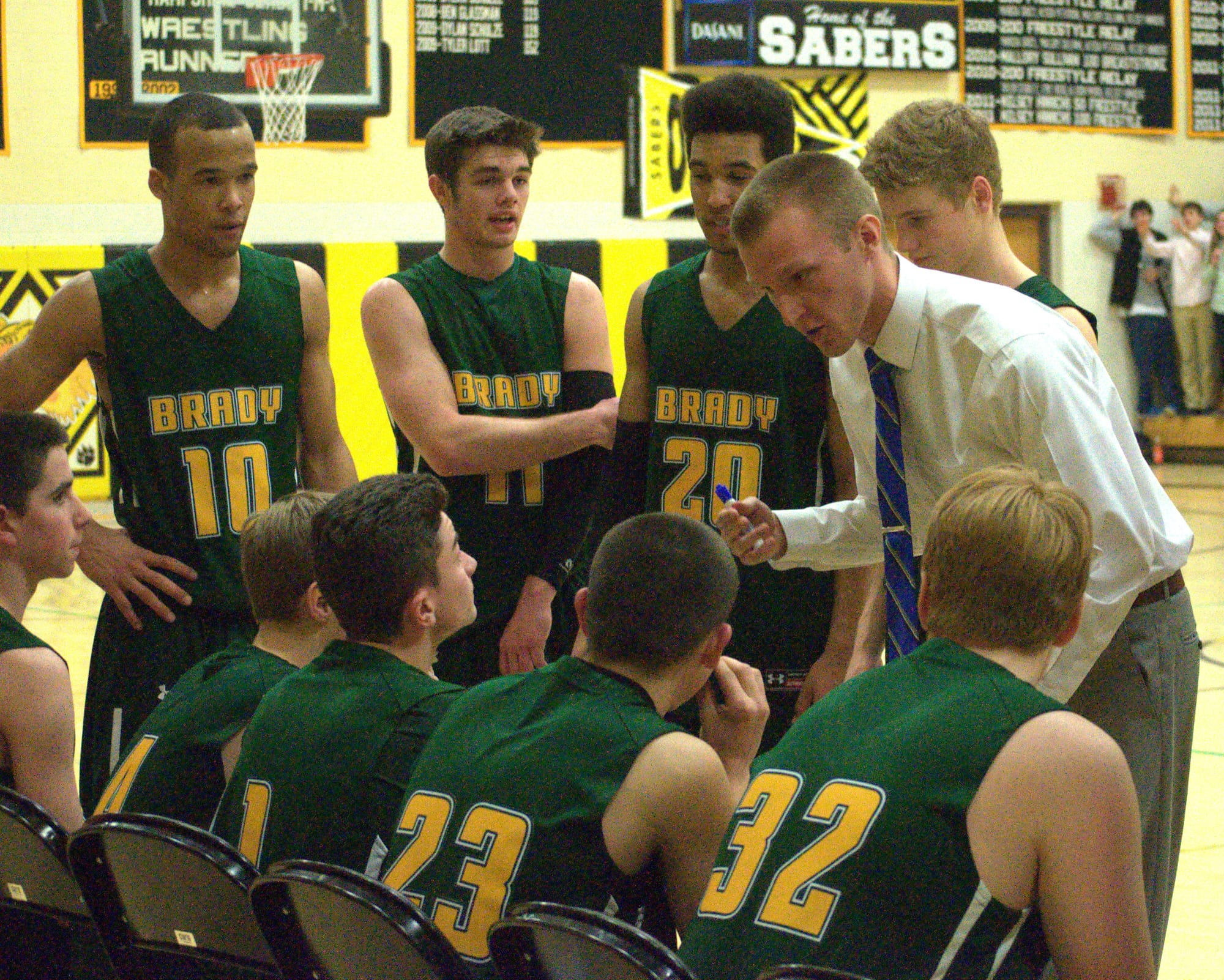 Bishop Brady coach Cole Etten talks to his team during a timeout.