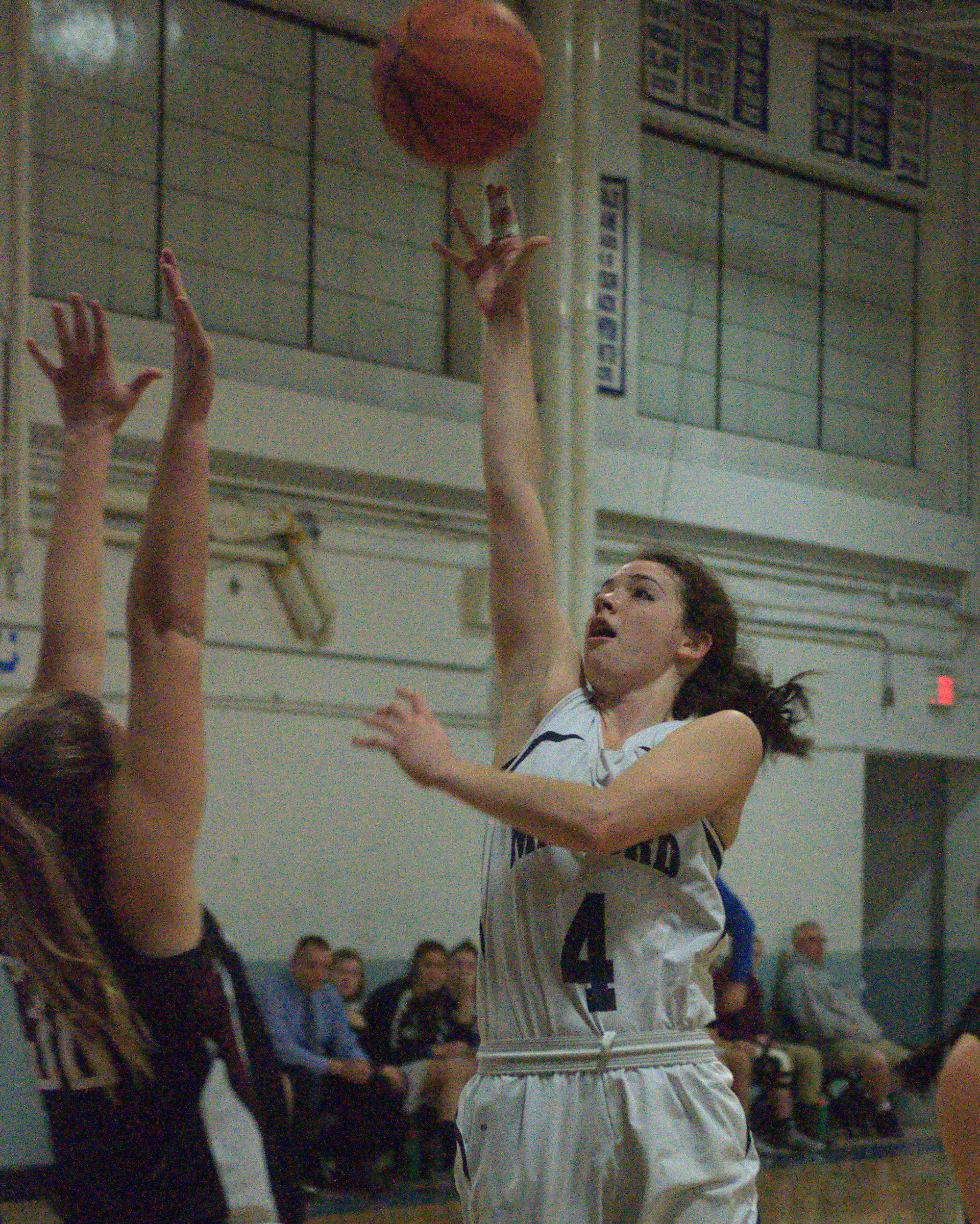 Milford's Adelle Pitsas shoots over Hanover's Caroline Rodi.