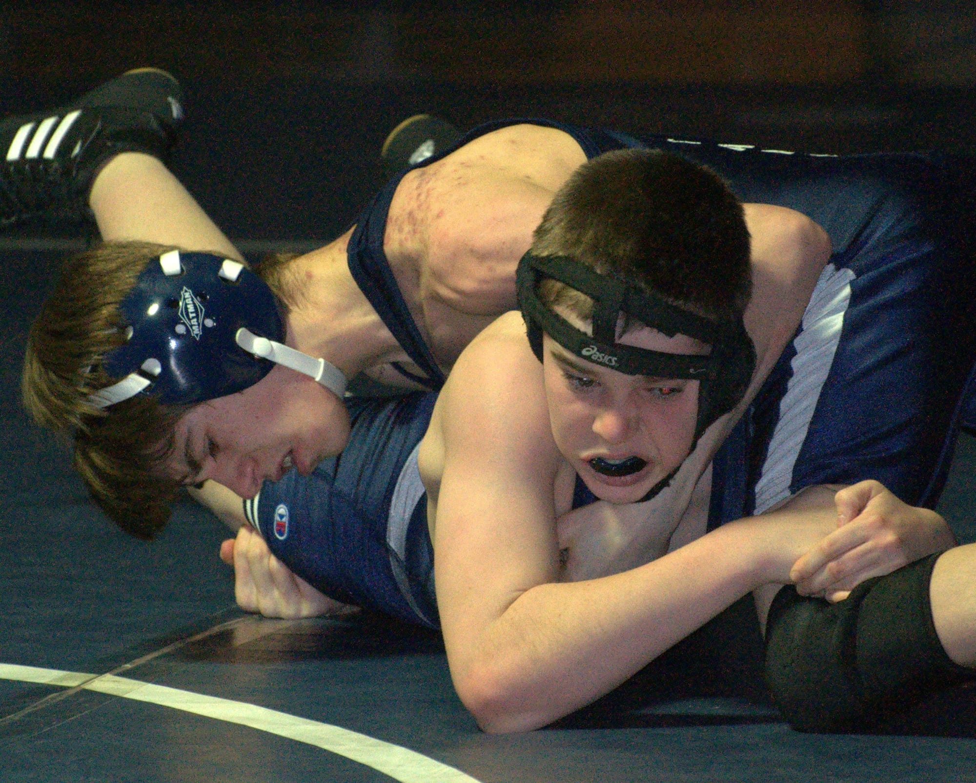 Hollis Brookline's Cameron Dreyer and Milford's Matt Digiosio wrestle in the 106-pound match.