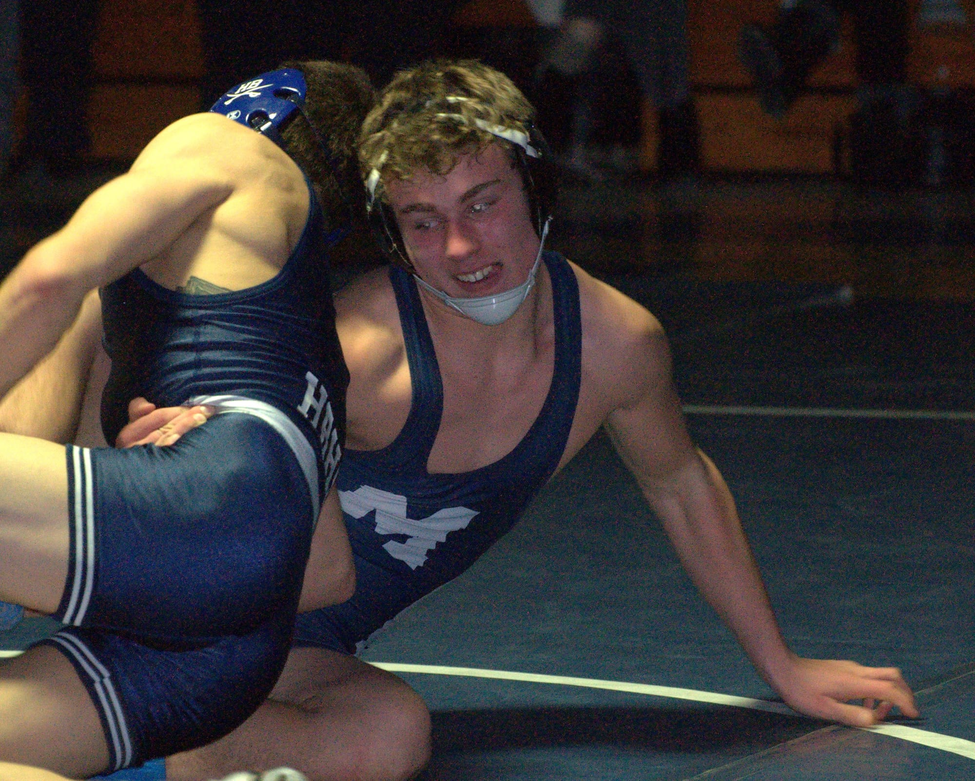 Milford's Ryan DeBernardo tries to keep Hollis Brookline's Lucas Cummings from getting the advantage.