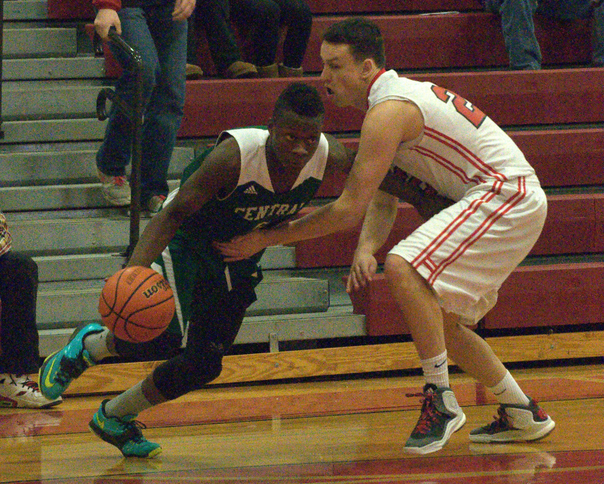 Manchester Central's Oumaru Kante gets by Bedford's Ryan Brown.