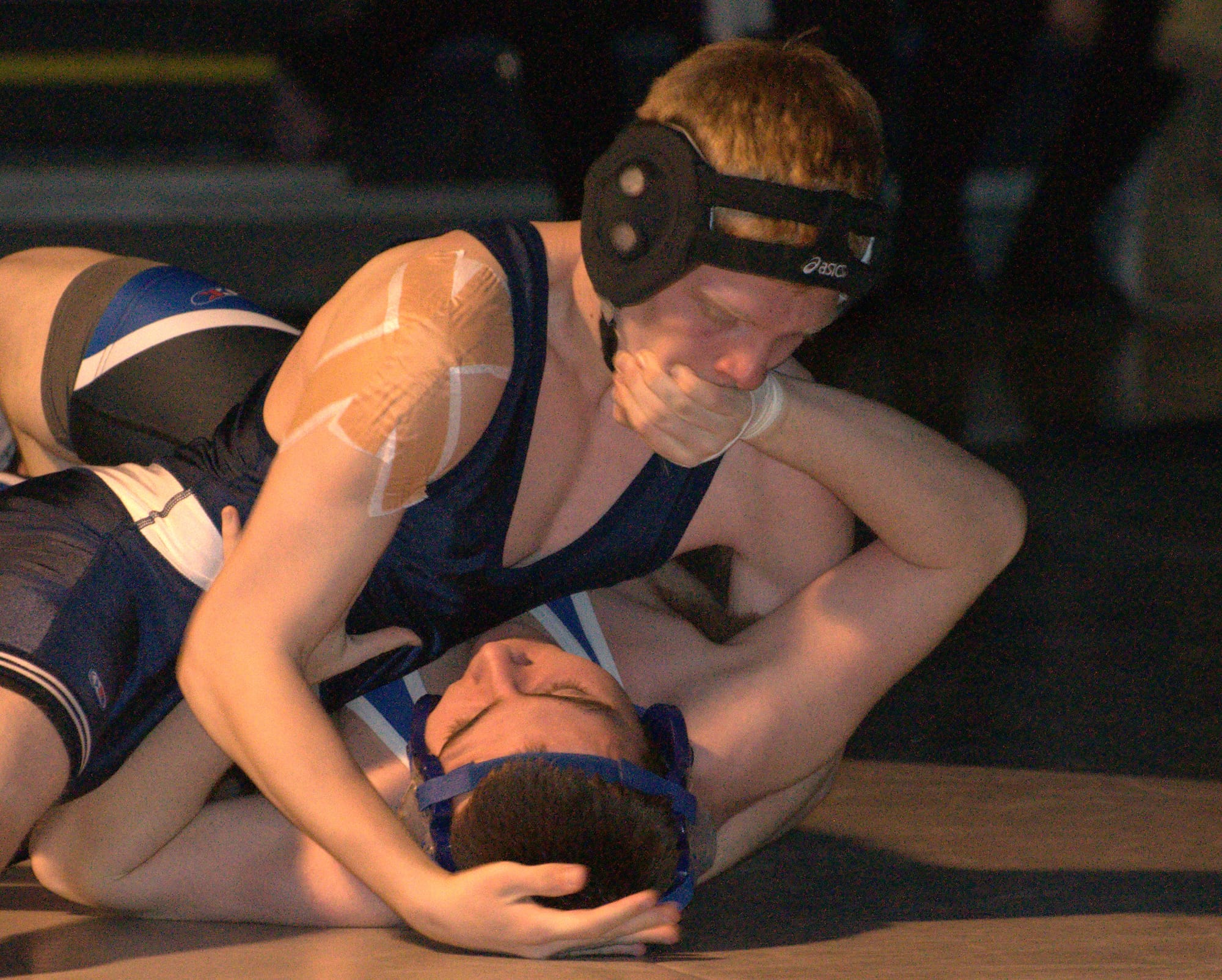 Hollis Brookline's Garrett Klausner tries to pin Merrimack's Nick Laroche during Wednesday's dual meet.