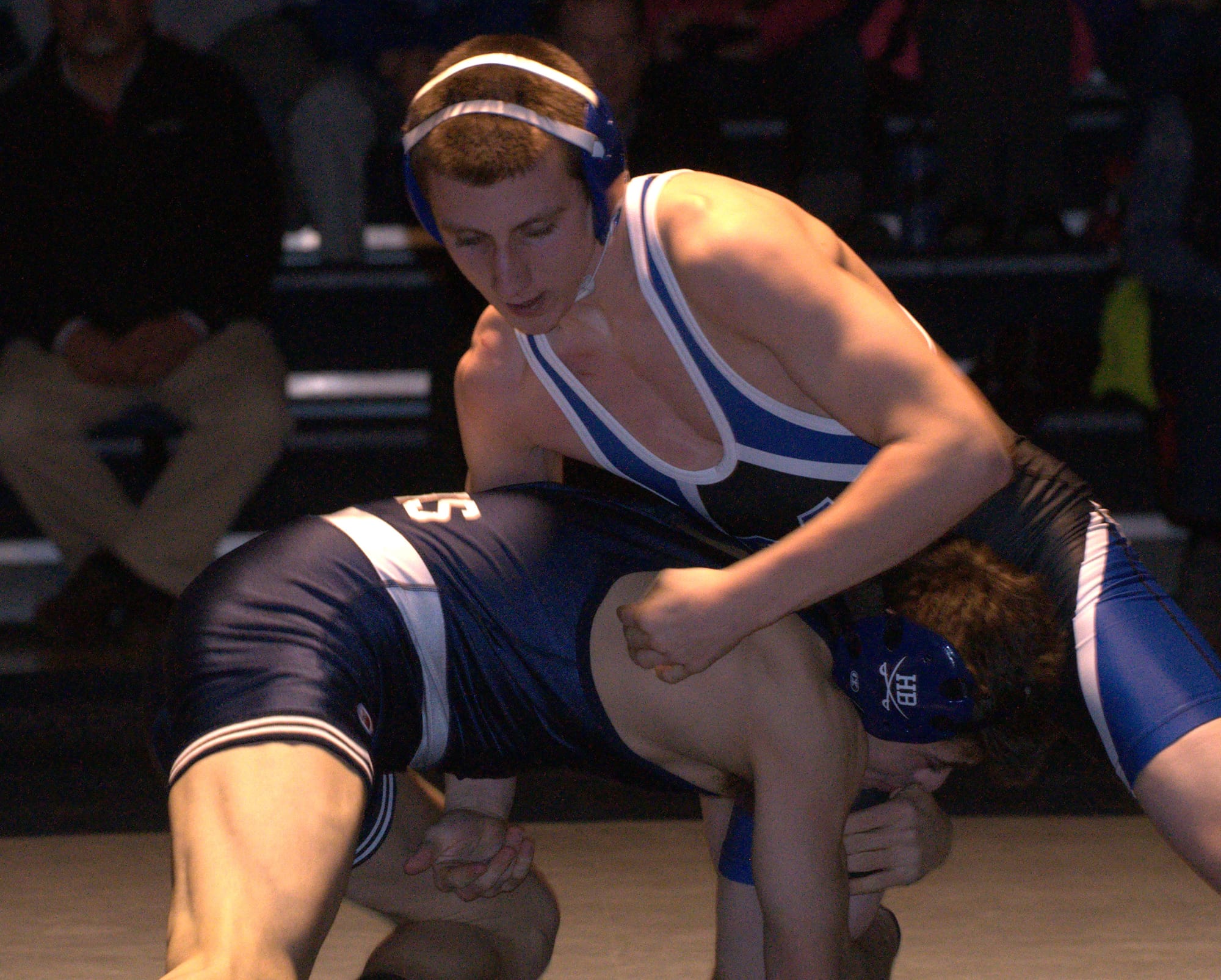 Merrimack's Sean Hebert wrestles against Hollis Brookline's Lucas Cummings.
