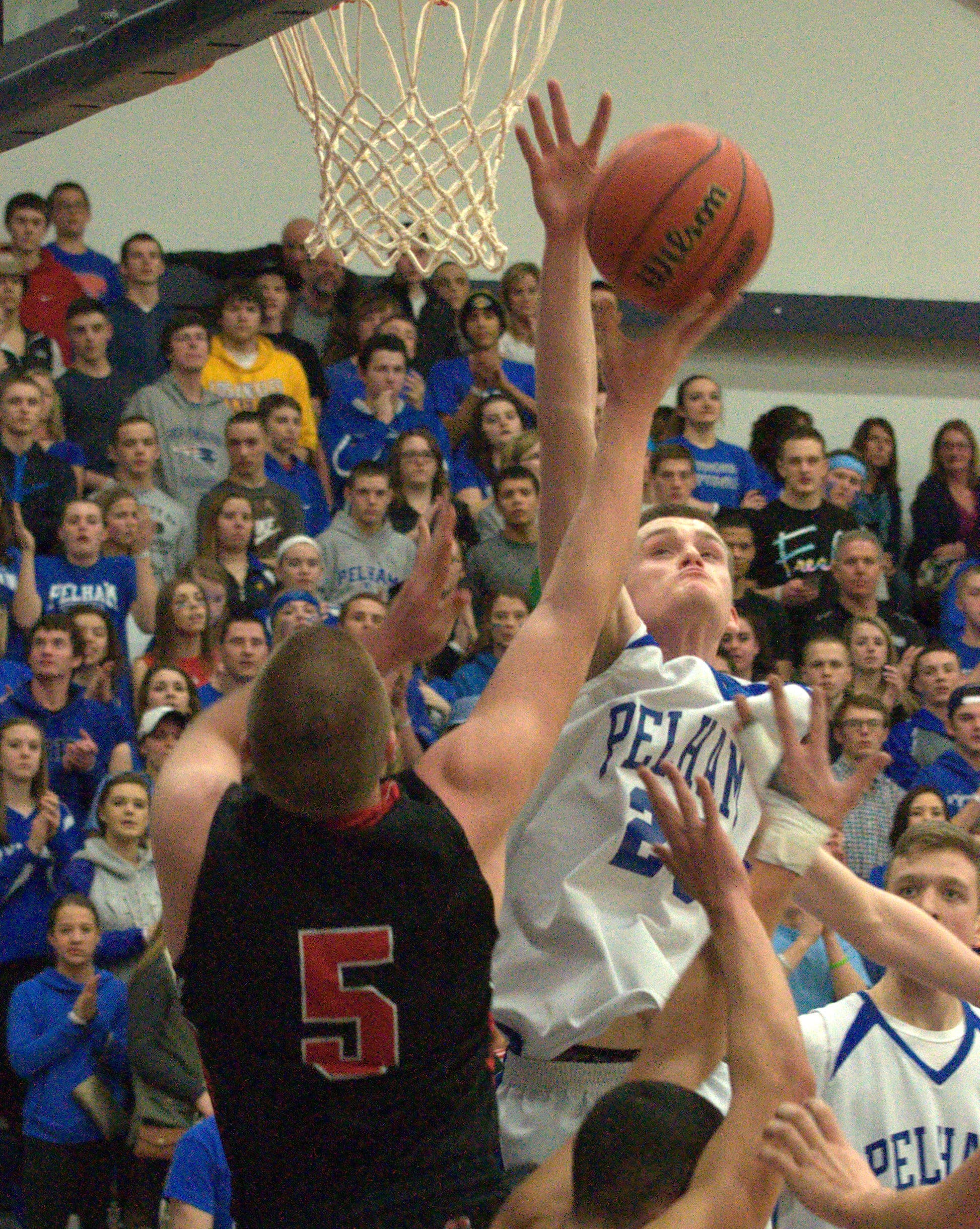 Pelham's Ryan Rondeau gets up to block a shot by Campbell's Harrison Vedrani.