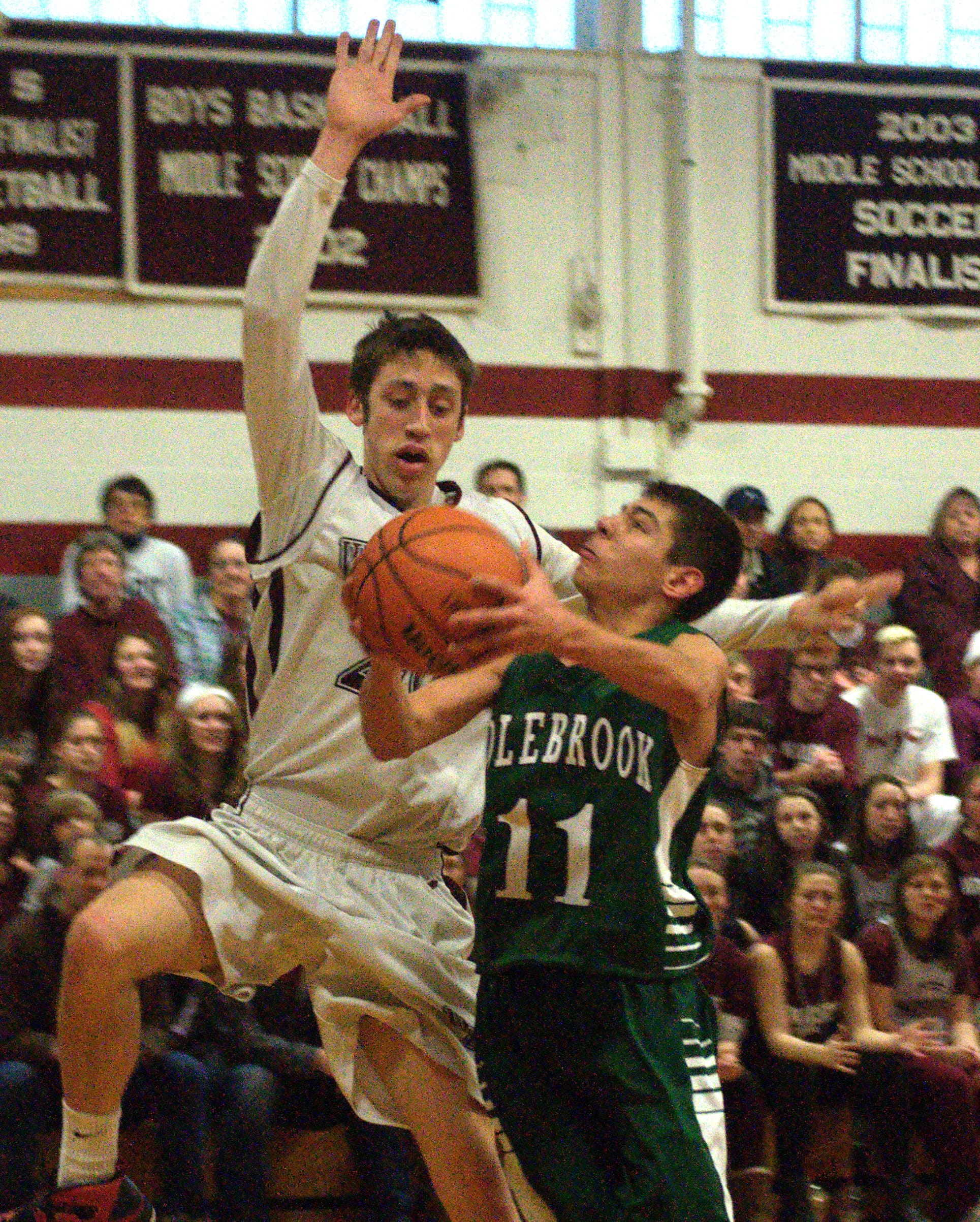 Wilton-Lyndeborough's Ty Carrier challenges a shot by Colebrook's John Zavala.
