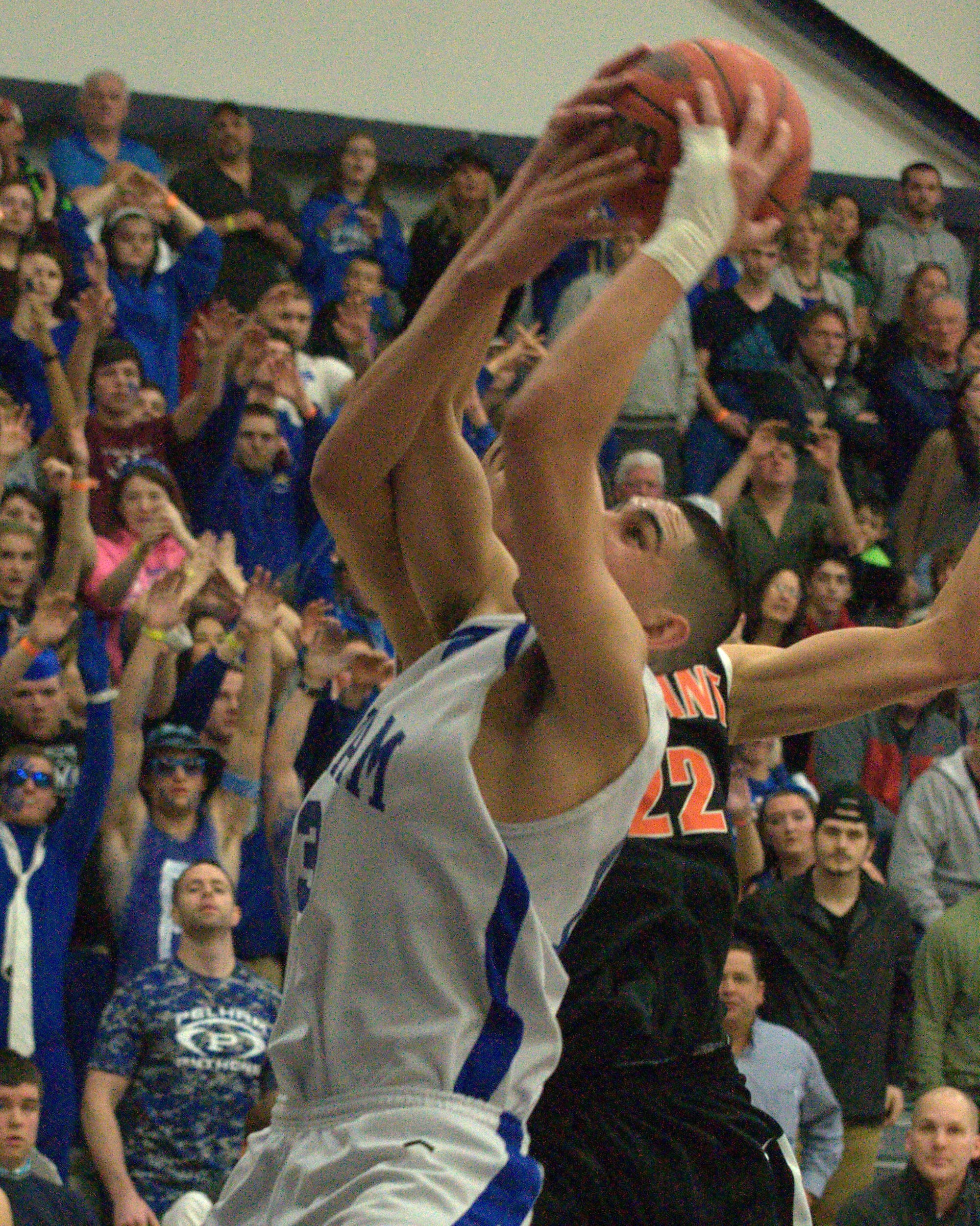 Pelham's Dylan Silvestri grabs a rebound over Conant's Brandon Ford.
