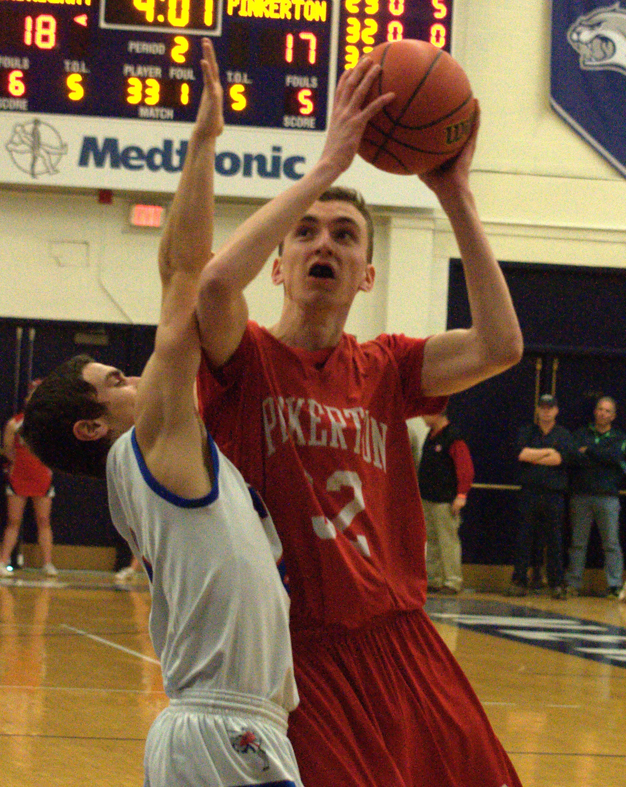 Pinkerton's Caleb Godin drives to the basket against Londonderry's Nate Gaw.