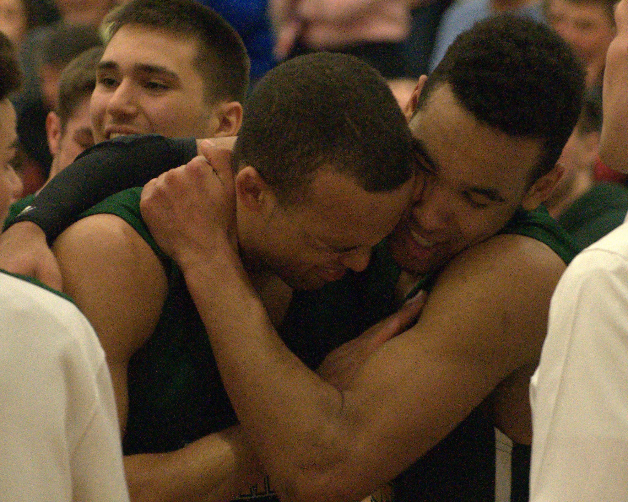 Joe Bell, right, hugs Jourdain Bell after the pair helped Bishop Brady win the Division II championship.