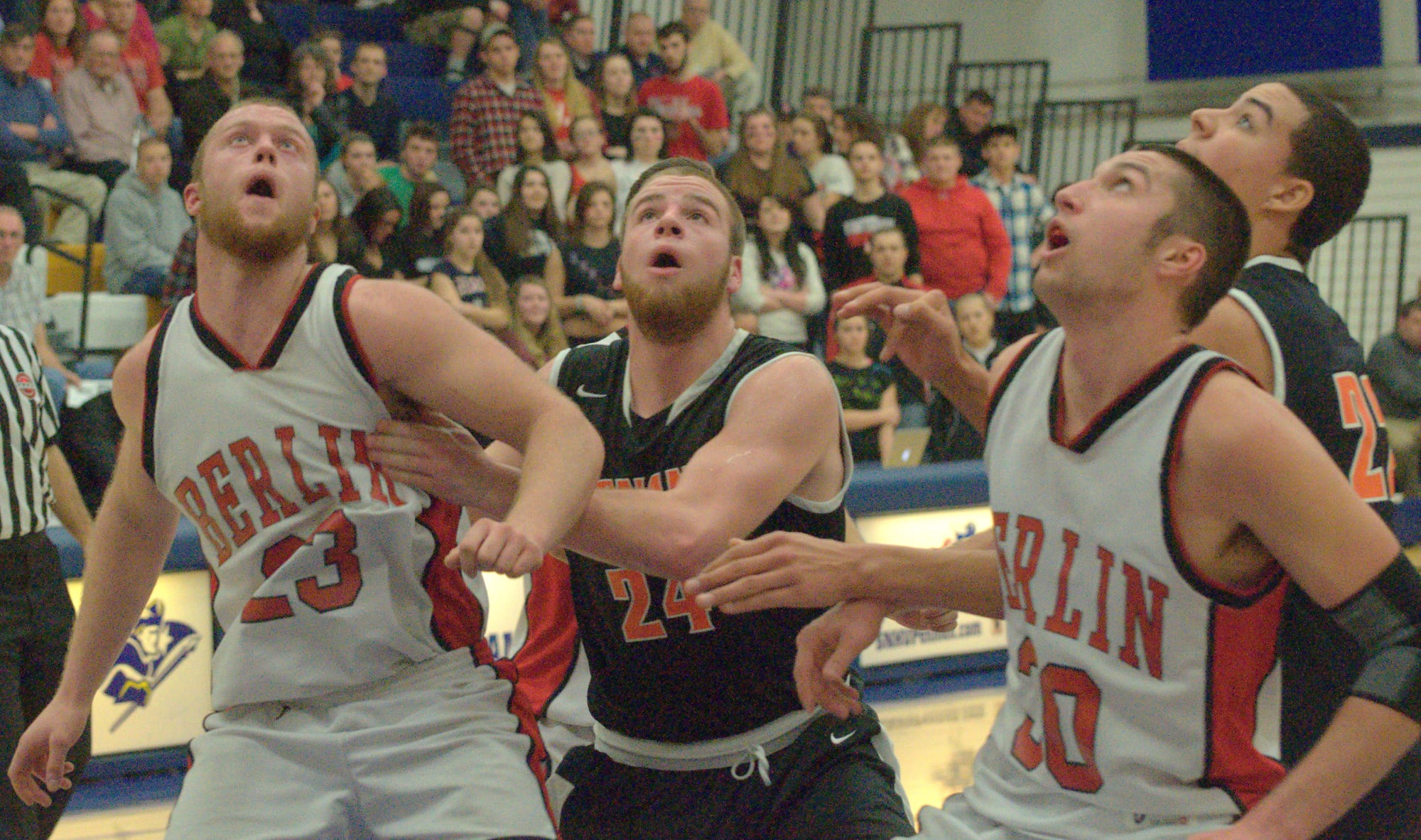 Berlin and Conant players wait for a rebound.