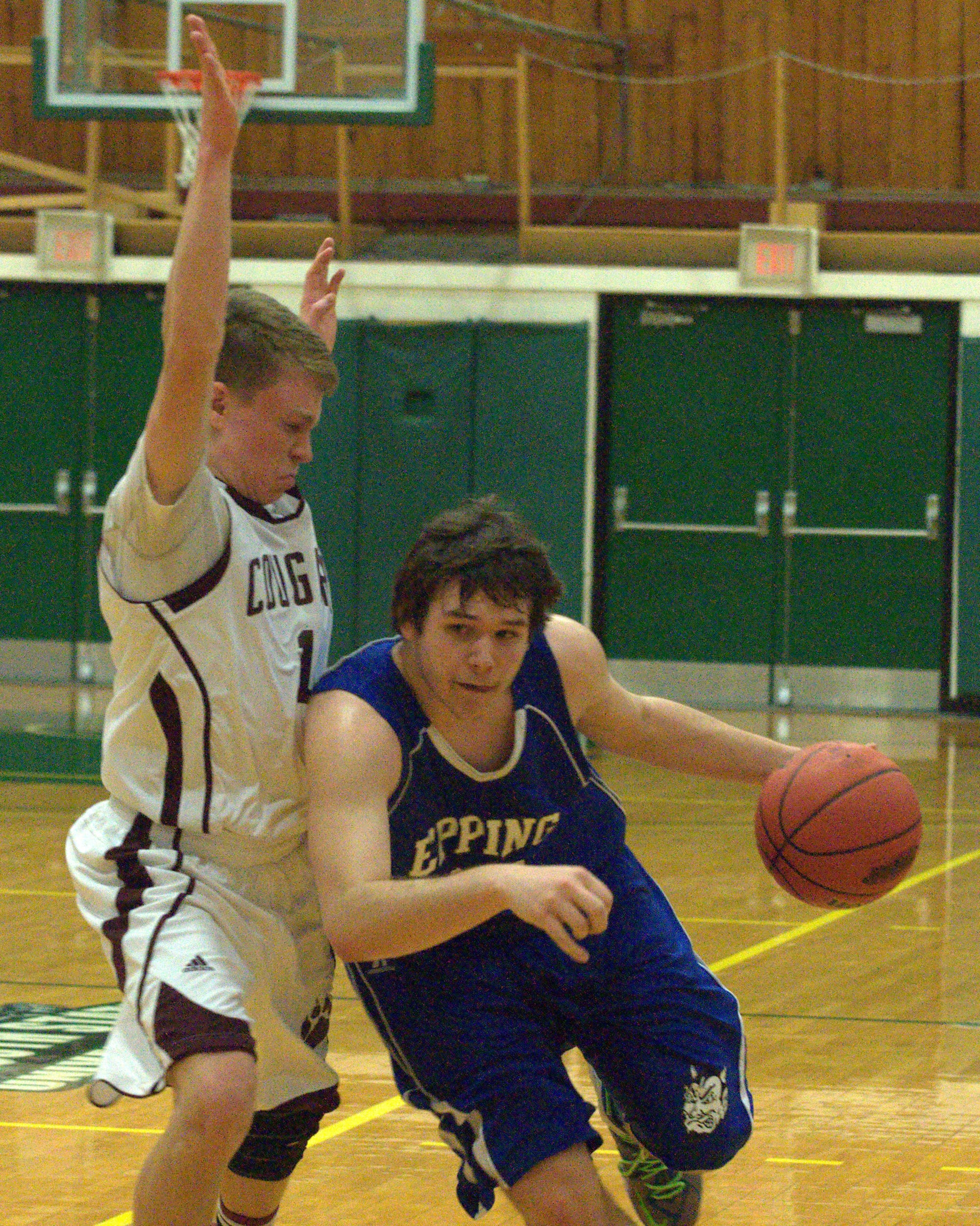 Epping's Colby Wilson tries to get by Derryfield's Pat McGinley.