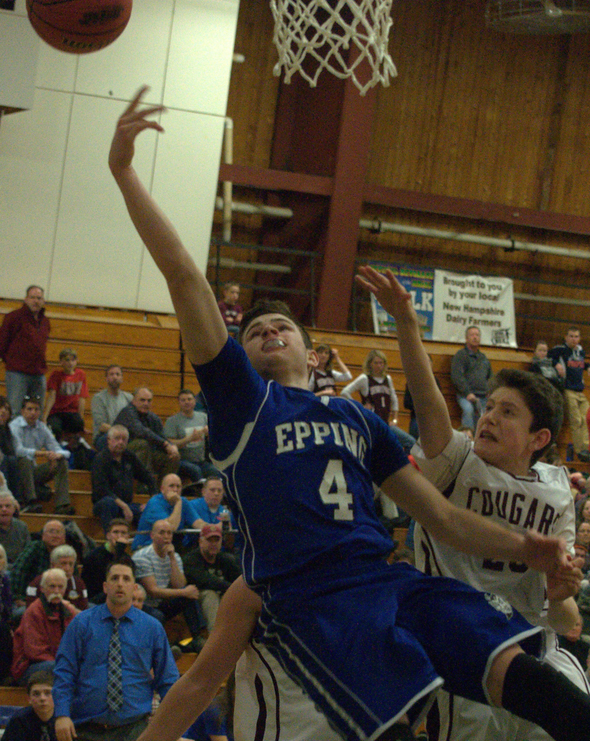 Epping's Dylan Derosier puts up a shot as Derryfield's Burton Owen defends during Monday's semifinal. For more photos, go to the Photo Album.