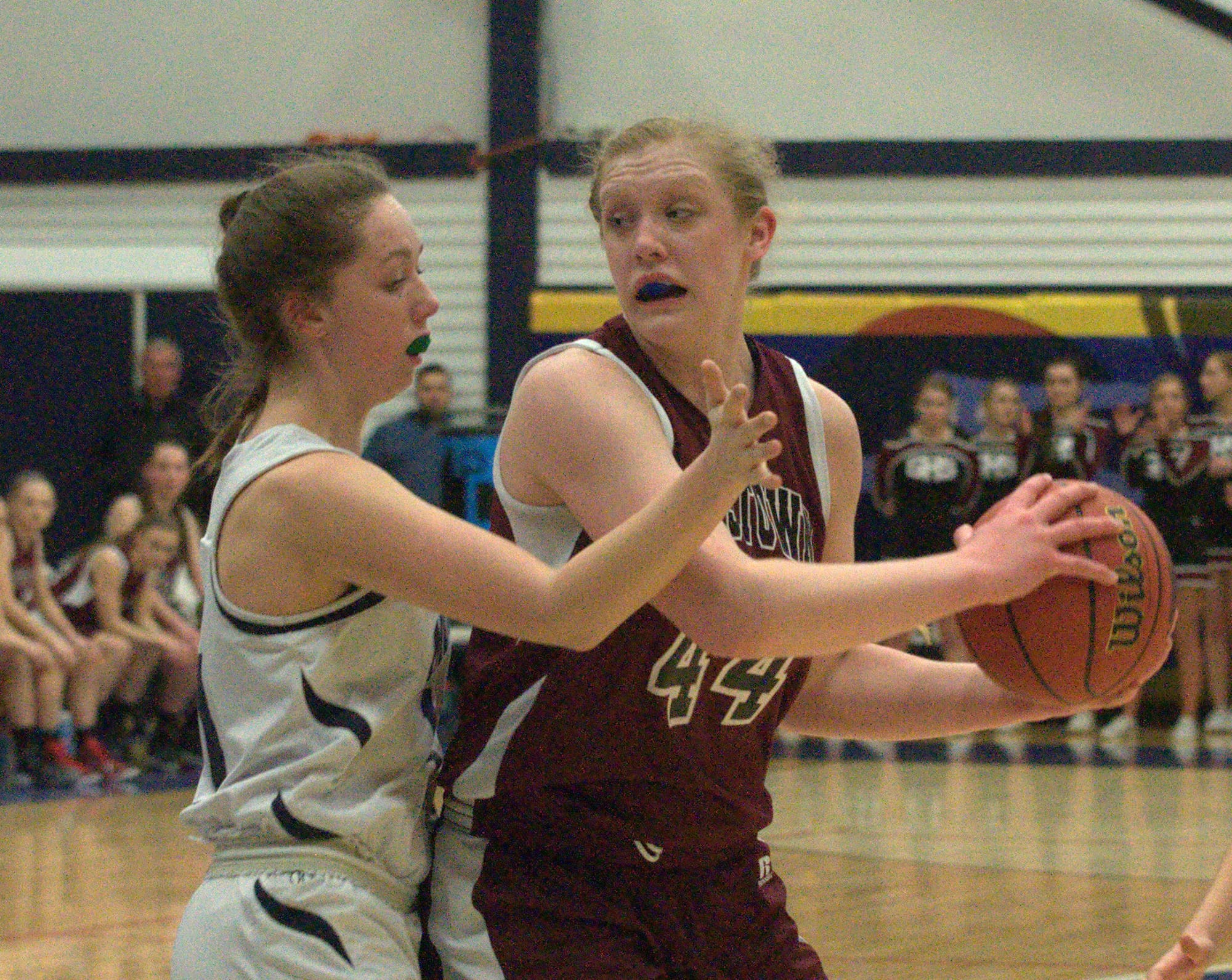 Milford's Kaitlyn Matthews defends against Goffstown's Rene Roggenbuck.