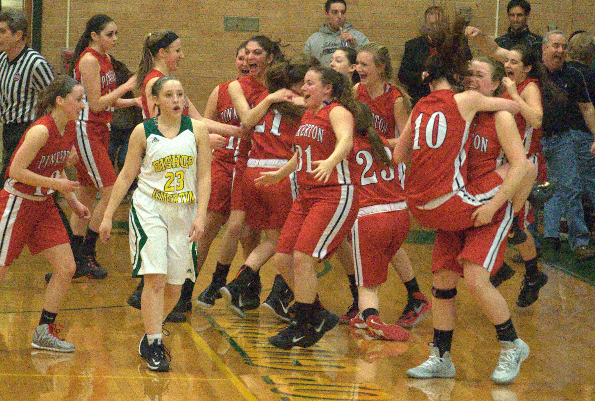 Pinkerton players celebrate after beating Bishop Guertin in the Division I quarterfinals.