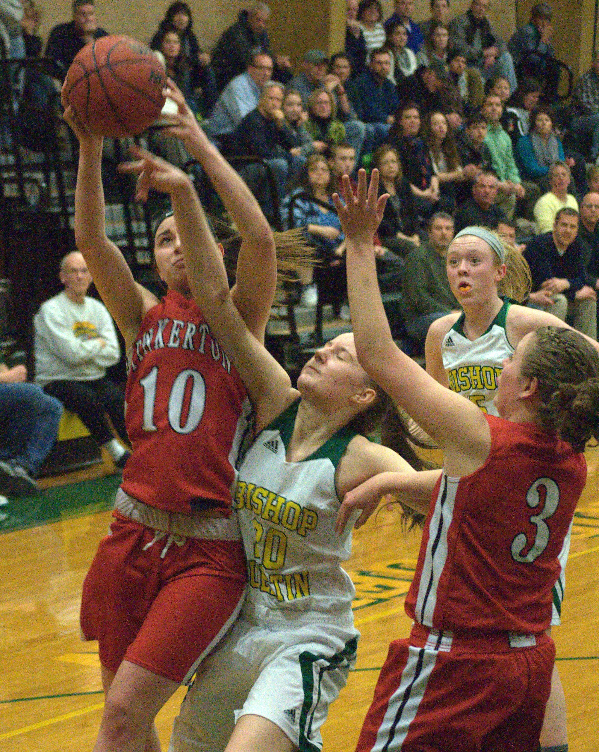Pinkerton's Valerie Martin grabs a rebound over Bishop Guertin's Brianna Nordengren