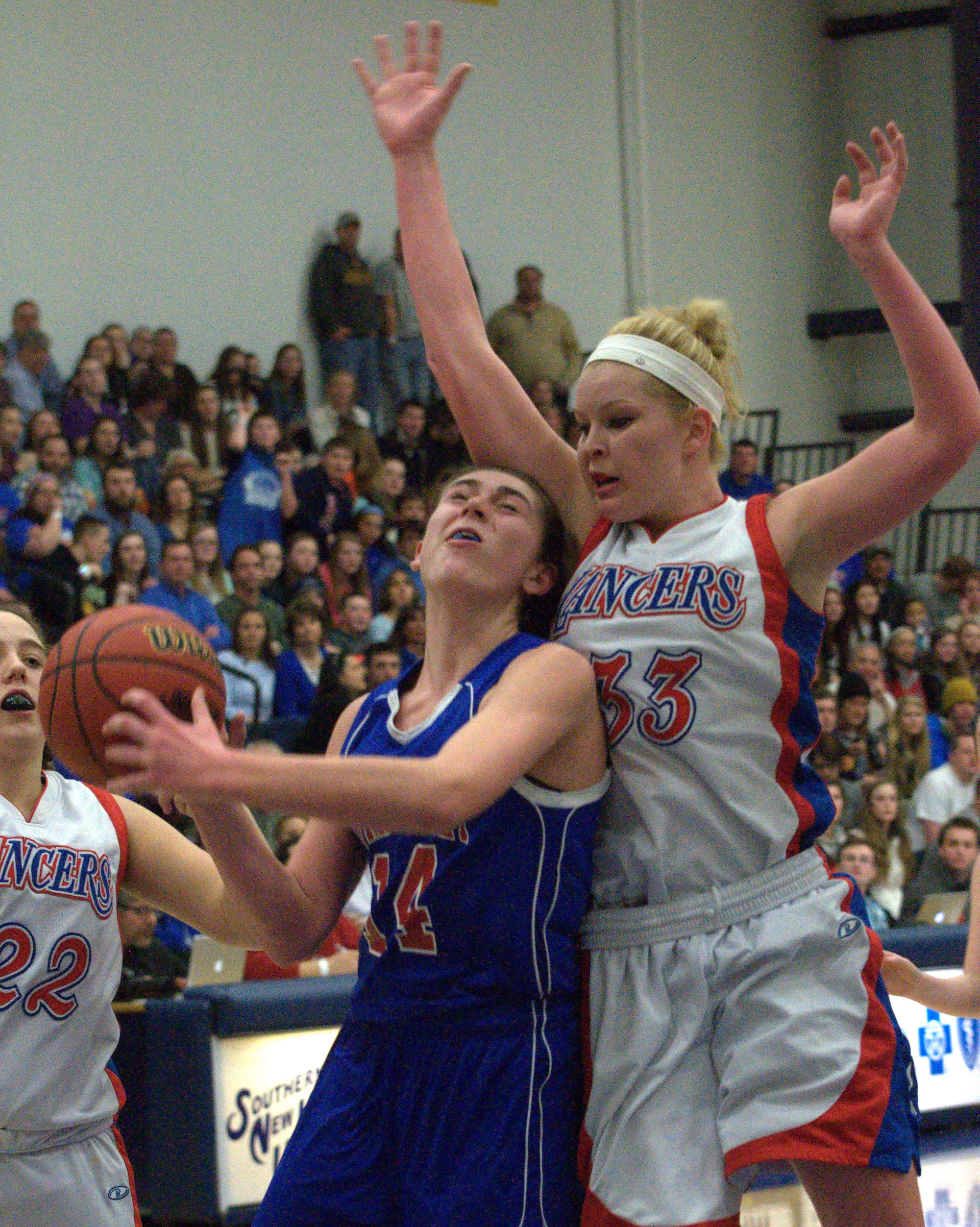 Winnacunnet's Meg Knollmeyer is fouled by Londonderry's Tara Burke during Friday's game.