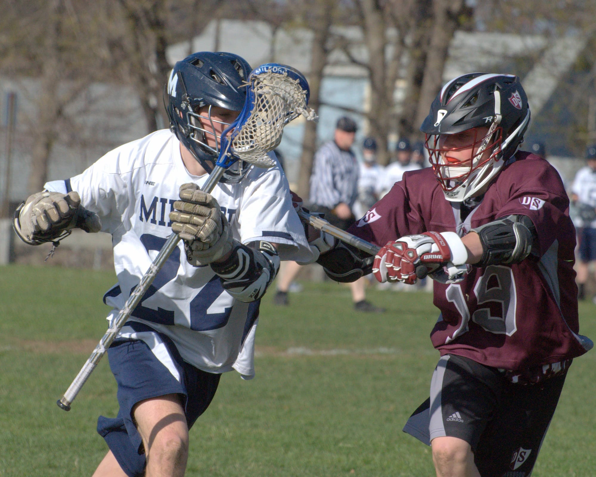 Derryfield's Brian Schwab tries to slow down Milford's Max Urda during Tuesday's game.