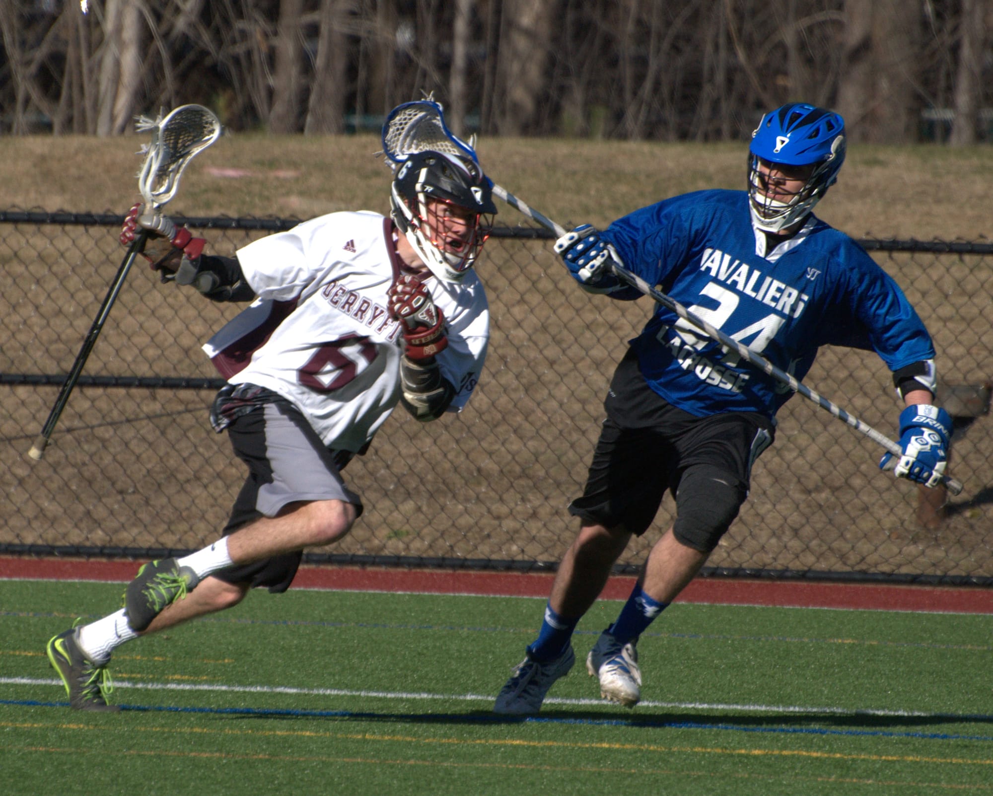 Derryfield's Michael Chiasson tries to get by Hollis Brookline's Ben Lombardi during Wednesday's game.