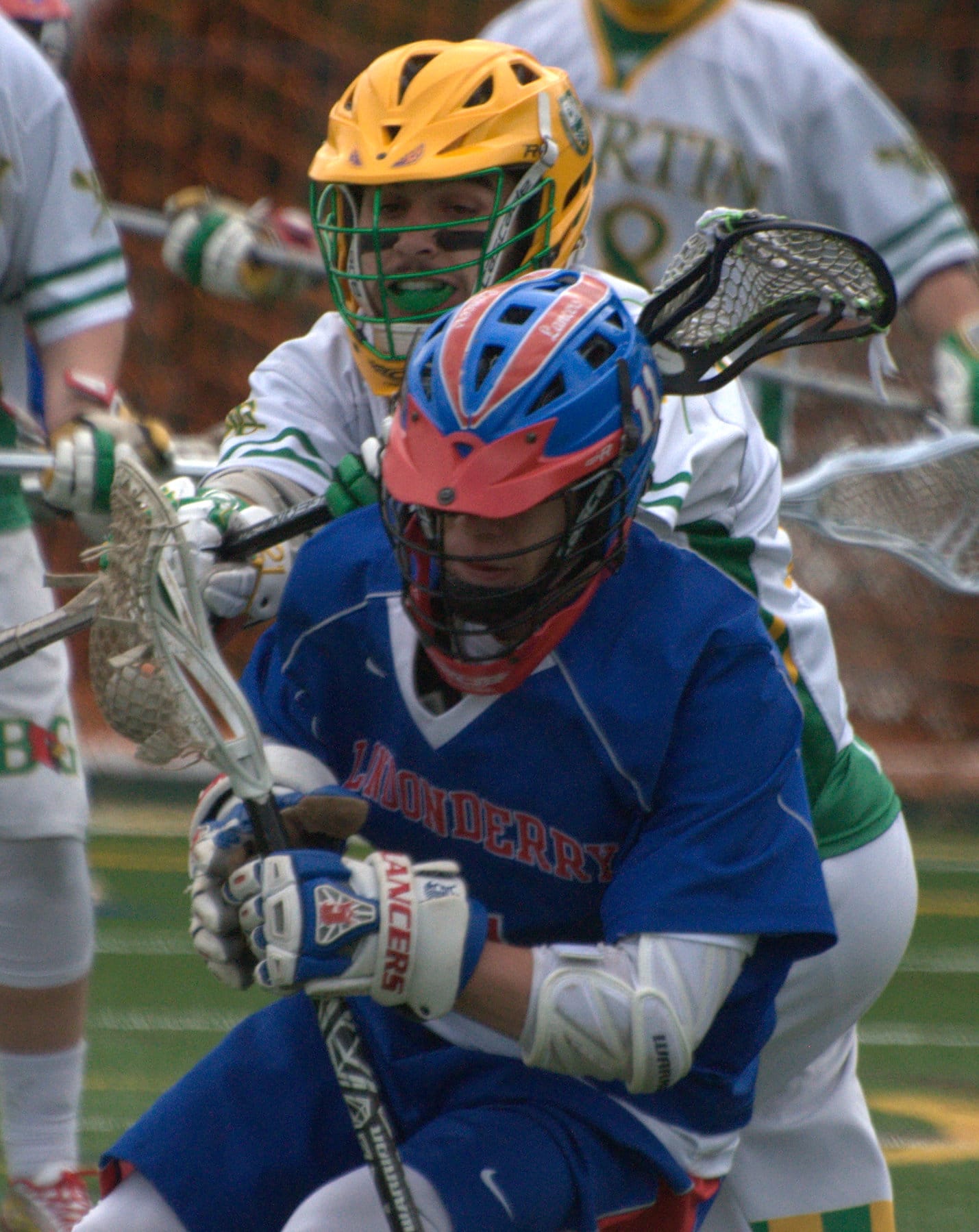 Londonderry's Len Carroll tries to shake Bishop Guertin's Mike Carluccio during Thursday's game.