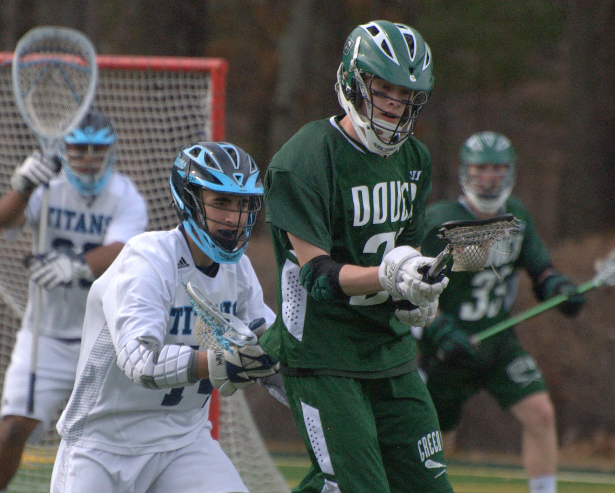 Dover's Ian Forbes tries to hang on to the ball as North's Tyler Dubien defends.