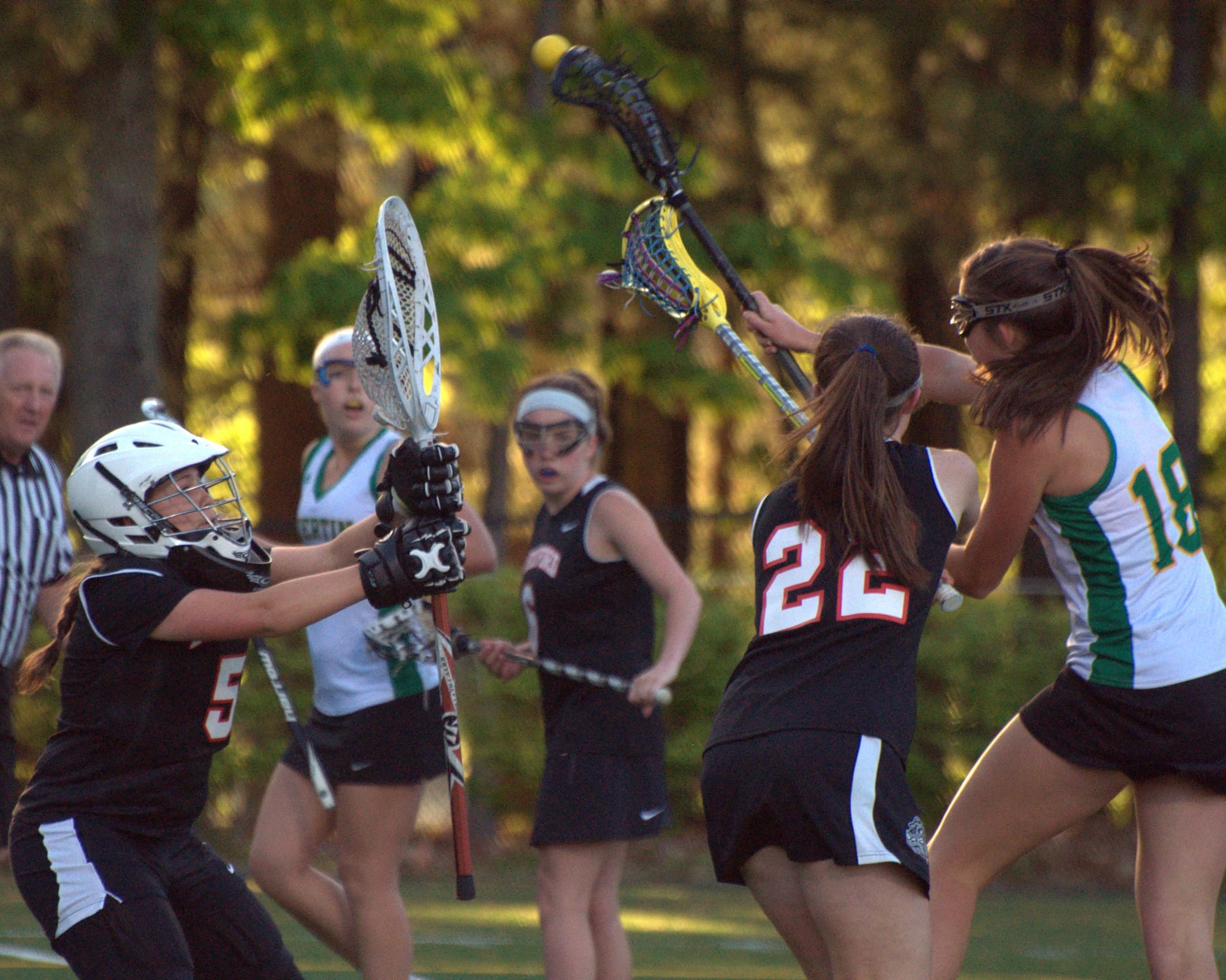 Bedford's Sierra Soghikian, left, and Molly Bierdmann try to stop a shot by Bishop Guertin's Bryn Carroll during Thursday's game.
