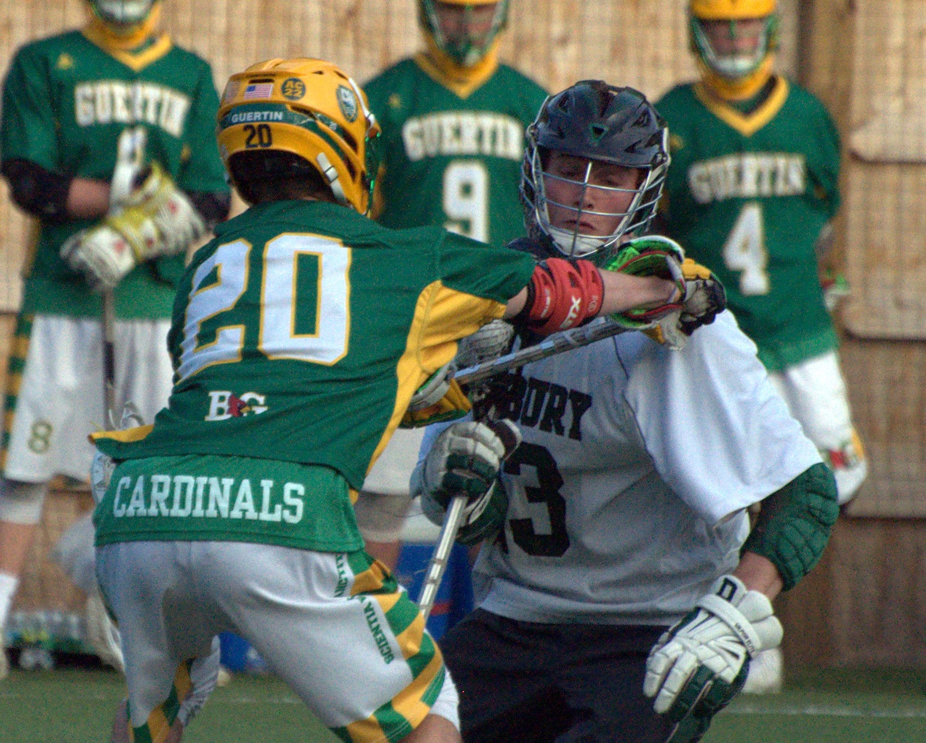 Duxbury's Harrison Piper tries to avoid Bishop Guertin's Gage Sevigny.