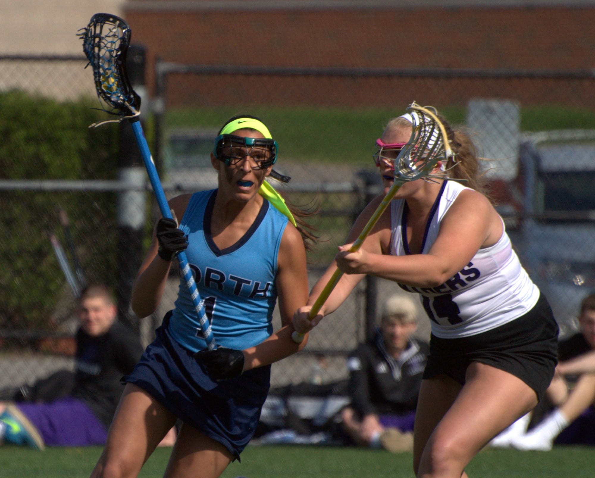 Nashua North's Christina Sulfaro tries to get by Nashua South's Emma Fenlon during Friday's game.