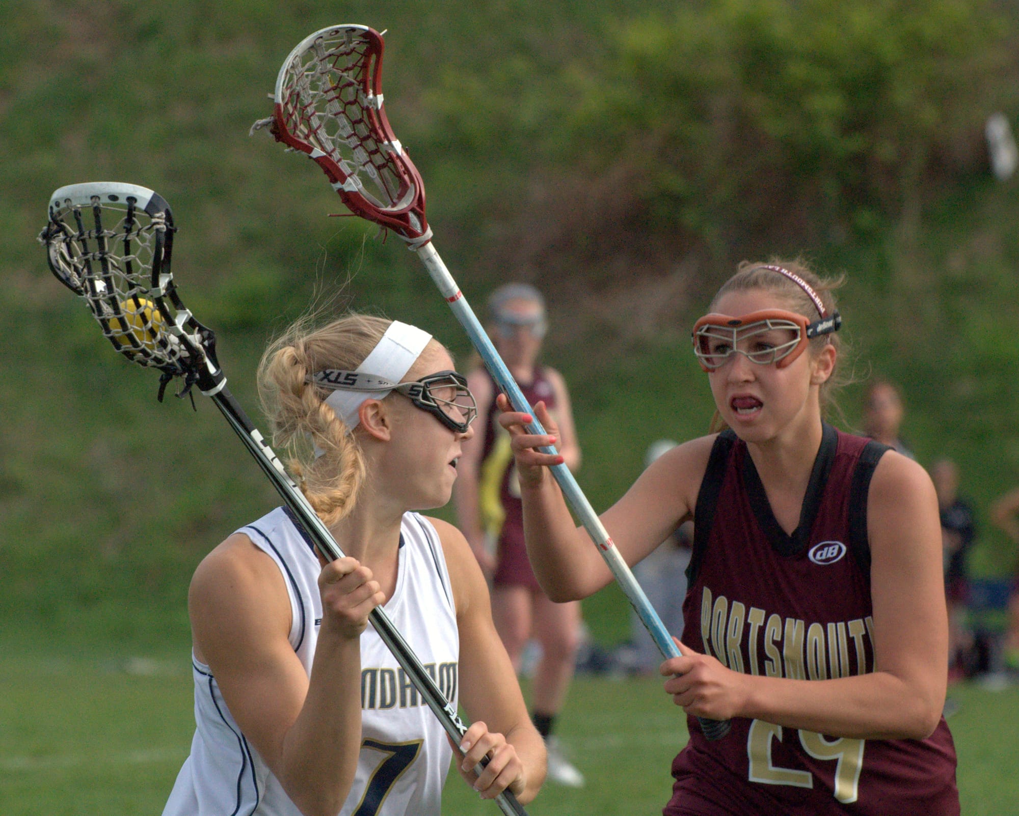 Windham's Lexi Lewis looks for a way around Portsmouth's Casey McDevitt during Thursday's game.