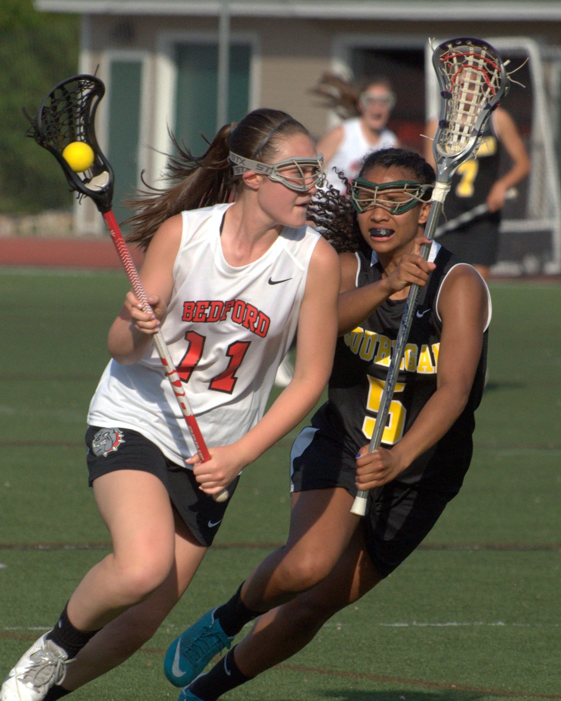 Souhegan's Hailey Johnson tries to slow down Bedford's Mackenzie Chou during Tuesday's game.