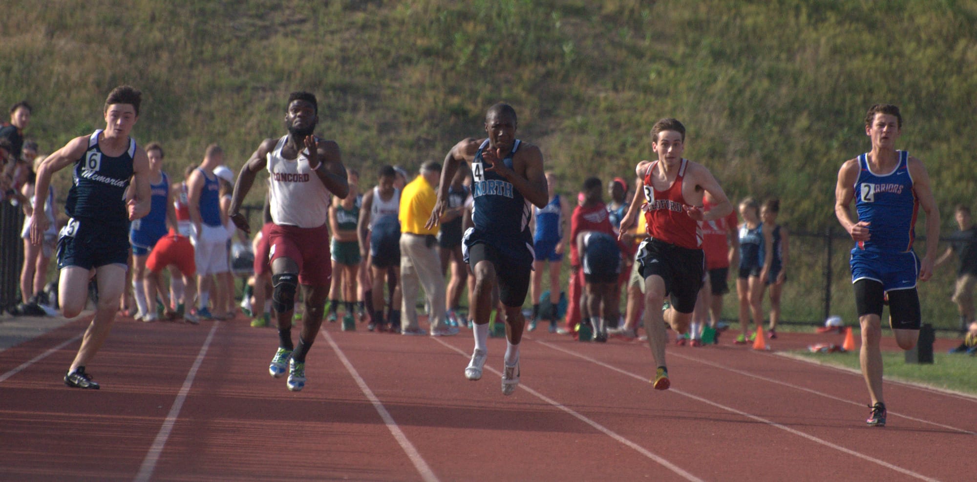Nashua North's Zakari Jenkins, center, won the 100- and 200-meter dashes for the third year in a row. For more photos, go to the Photo Album.