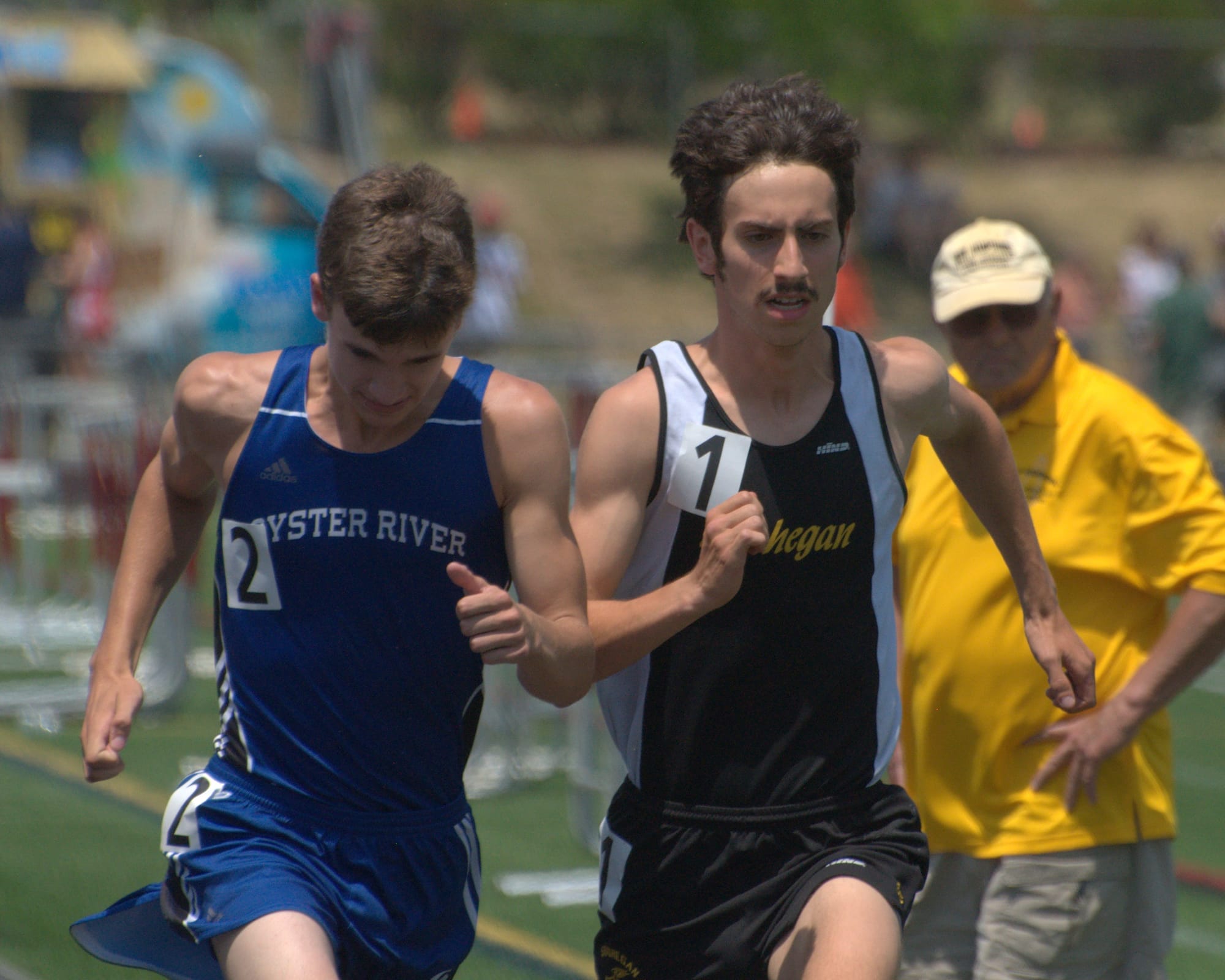 Oyster River's Patrick O'Brien and Souhegan's Eli Moskowitz run during the 1,600 meters Saturday. For more photos, go to the Photo Album.